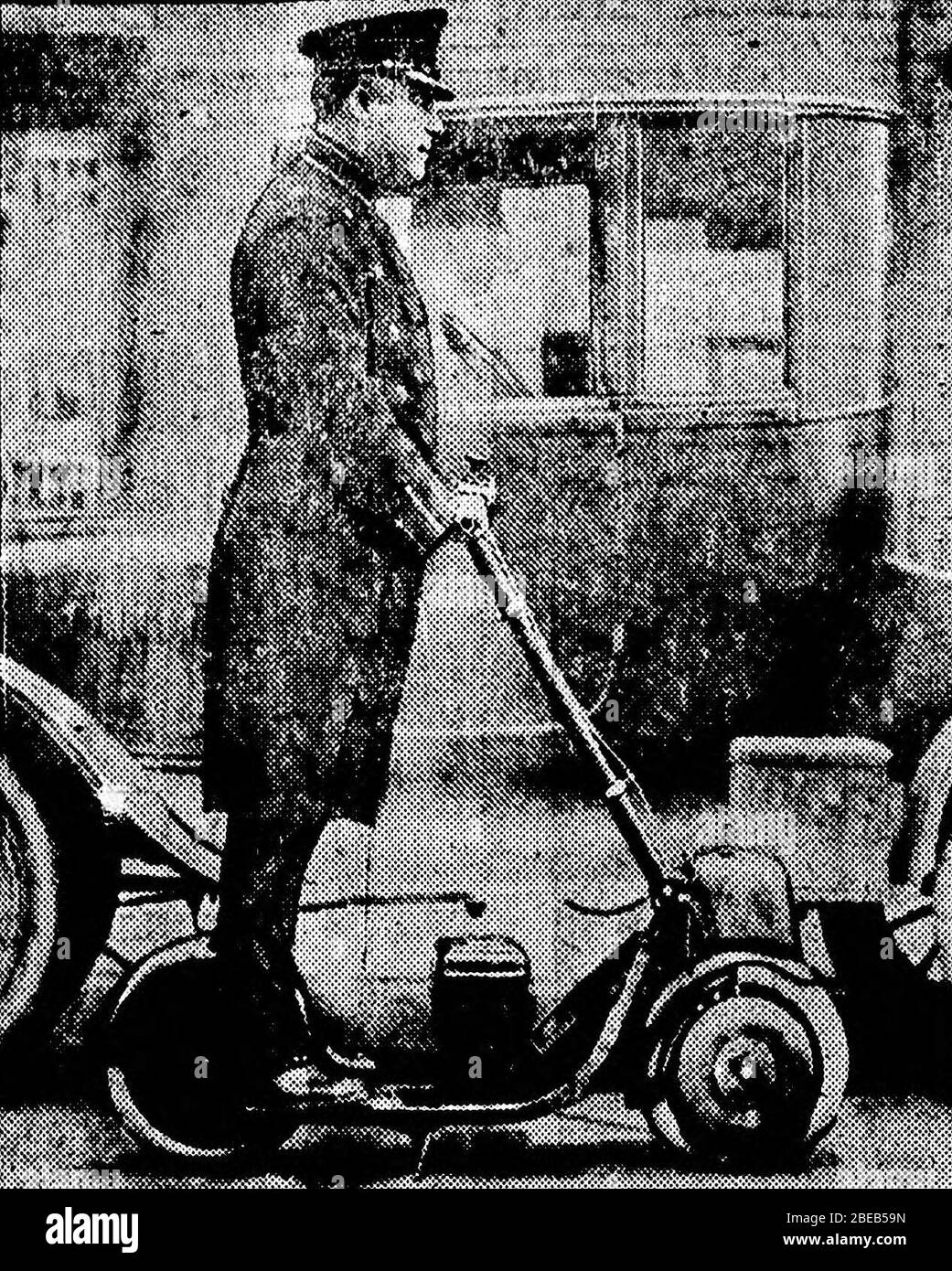 'Historical photo of an autoped in use. Original caption: Timothy Porter, traffic cop at Newark, N.J.,rides about on an autoped to untangle traffic tie-ups.; 31 March 1922; LOC; The Bismarck tribune; ' Stock Photo