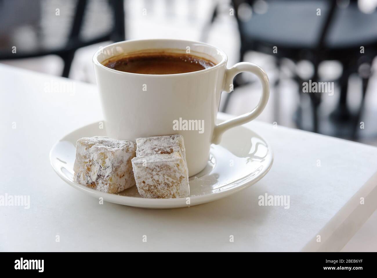 Cup of Greek Turkish coffee isolated on white background with sweety