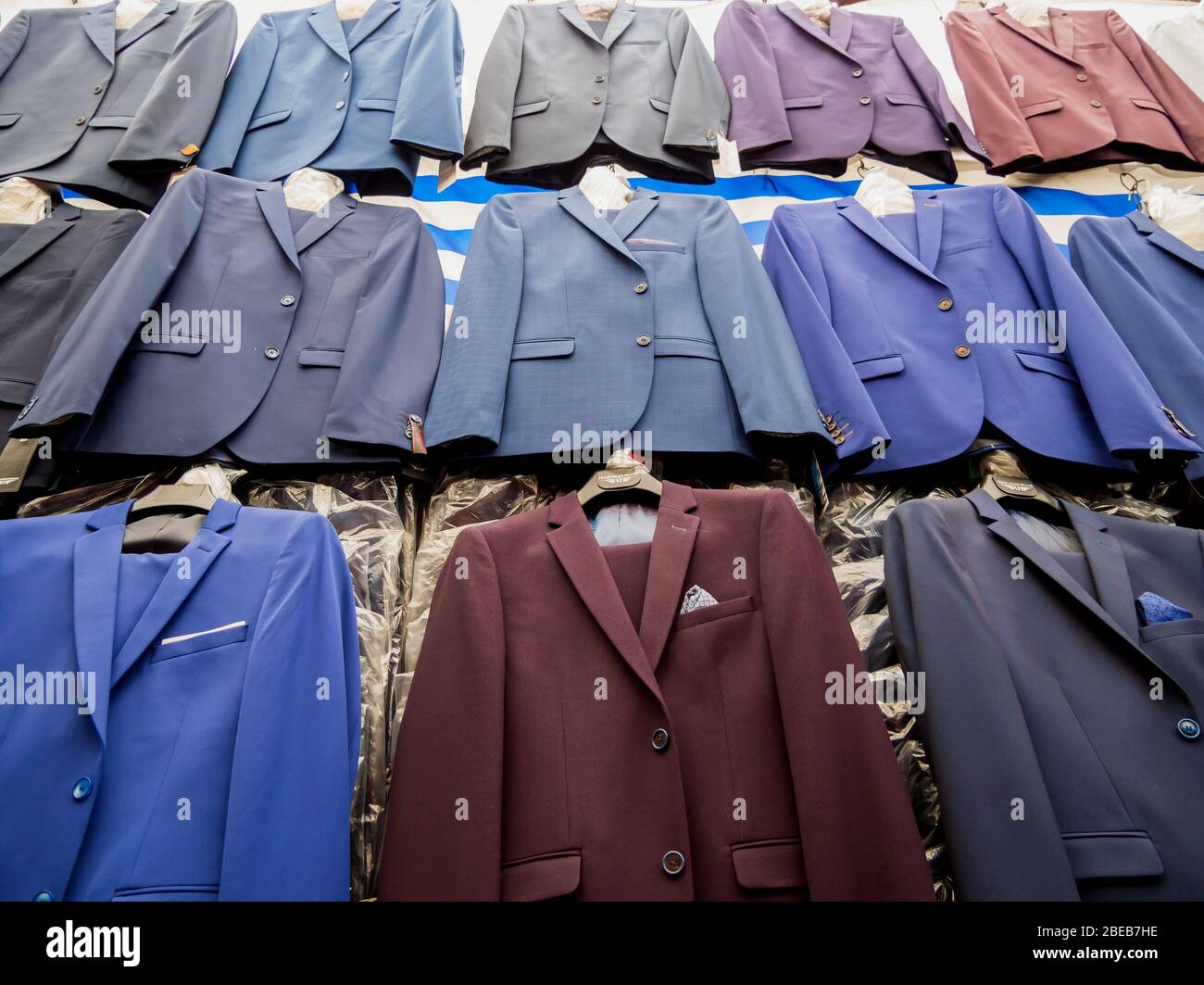 Men's suits in a shop market outlet Stock Photo