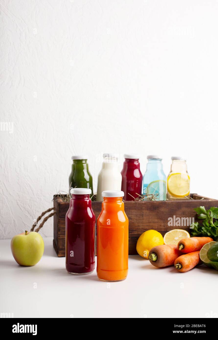Healthy smoothie in glass bottles and fresh vegetables Stock Photo - Alamy