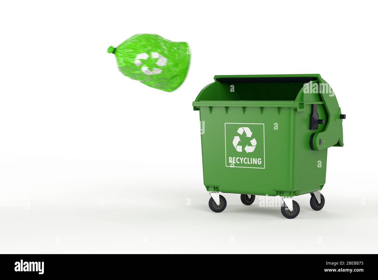 a single green garbage bag flying to an open dumpster Stock Photo