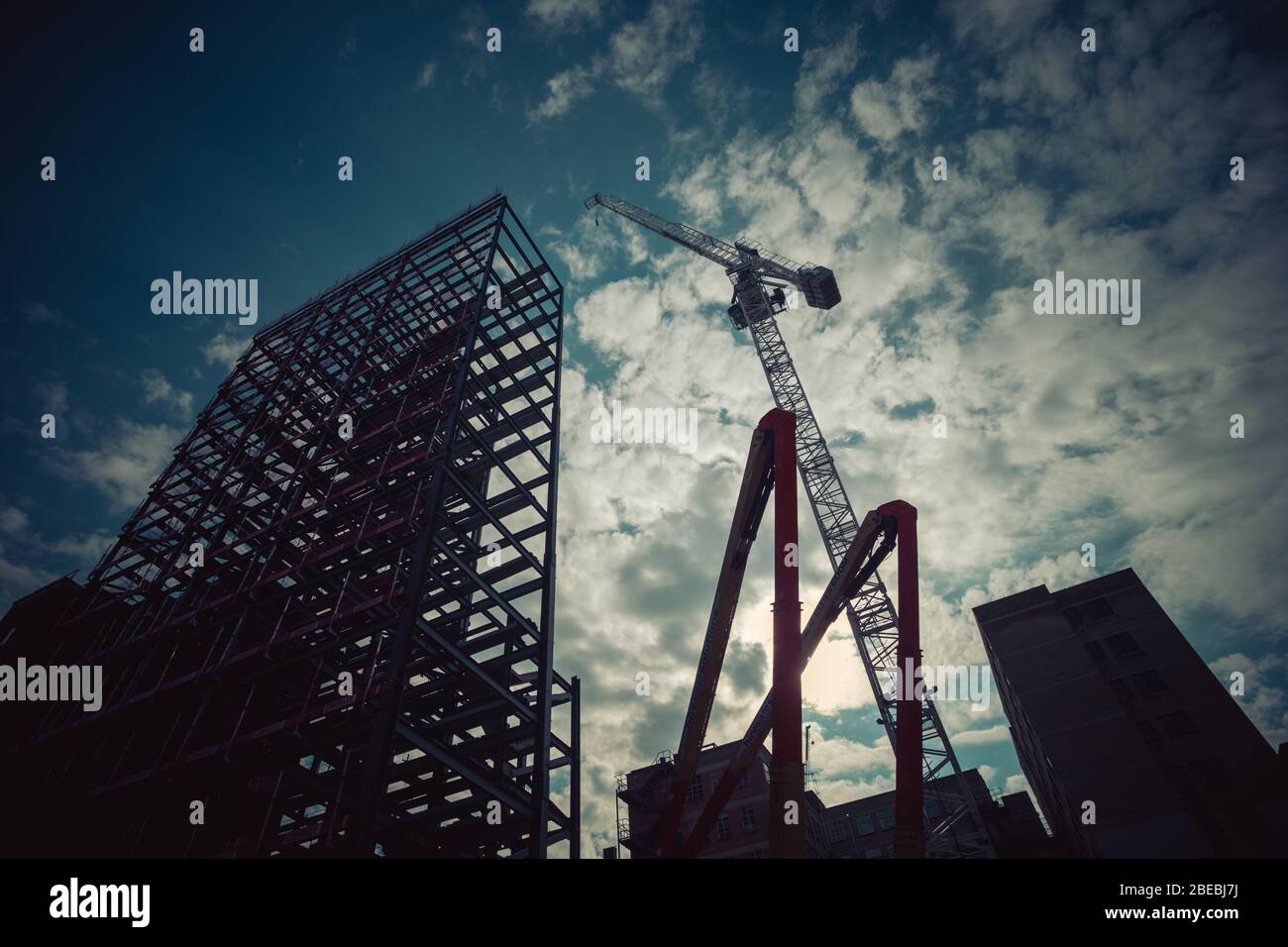 Construction site with crane against the sun Stock Photo