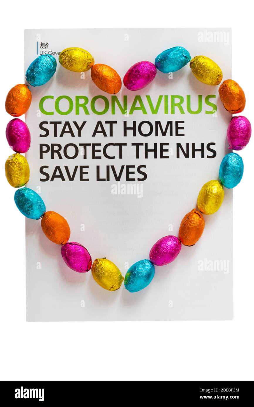Coronavirus Stay at Home Protect the NHS Save Lives details from letter from UK Government, Boris Johnson to all UK households, with Easter eggs heart Stock Photo