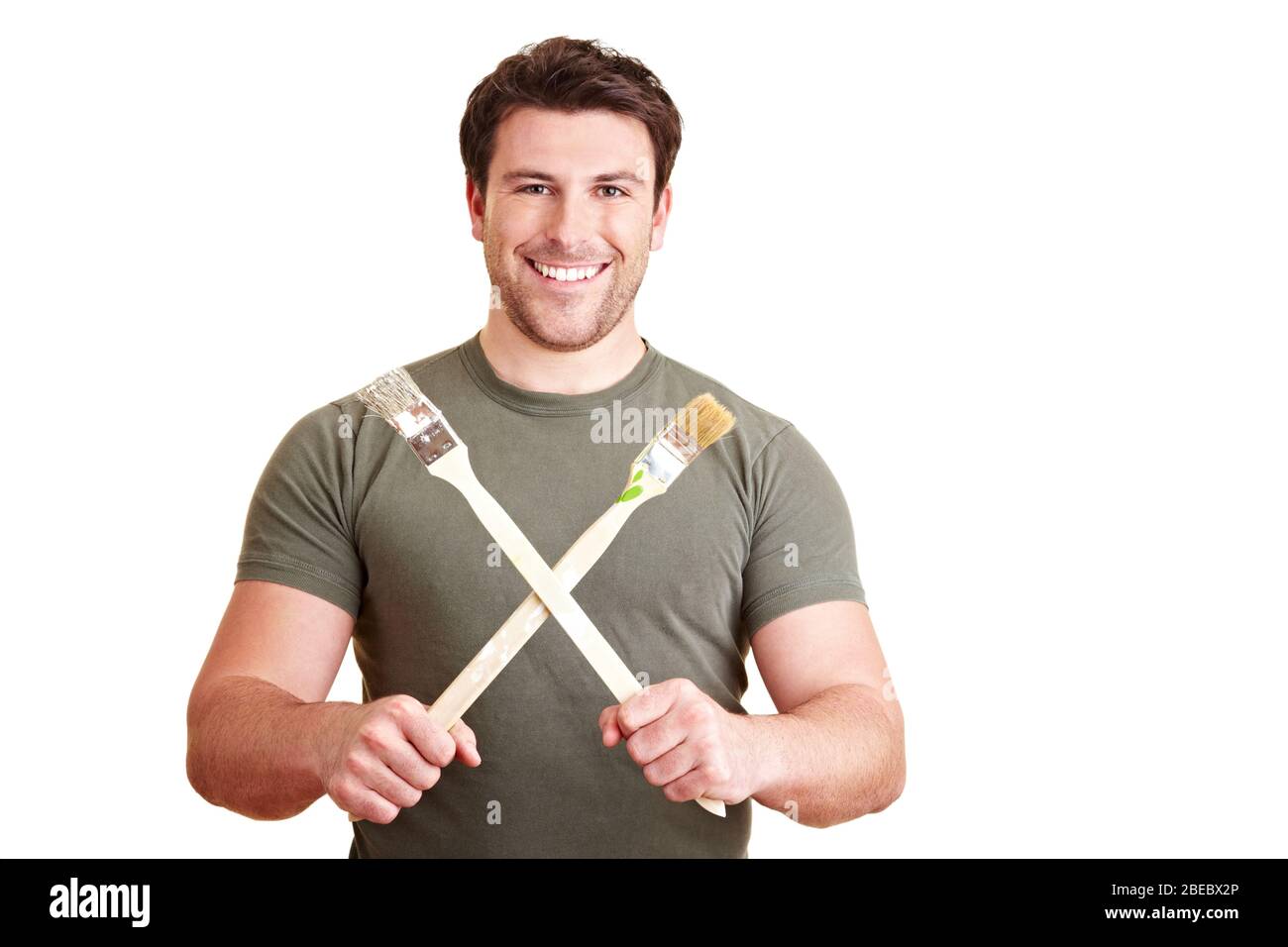 Painter holds two brushes crossed Stock Photo