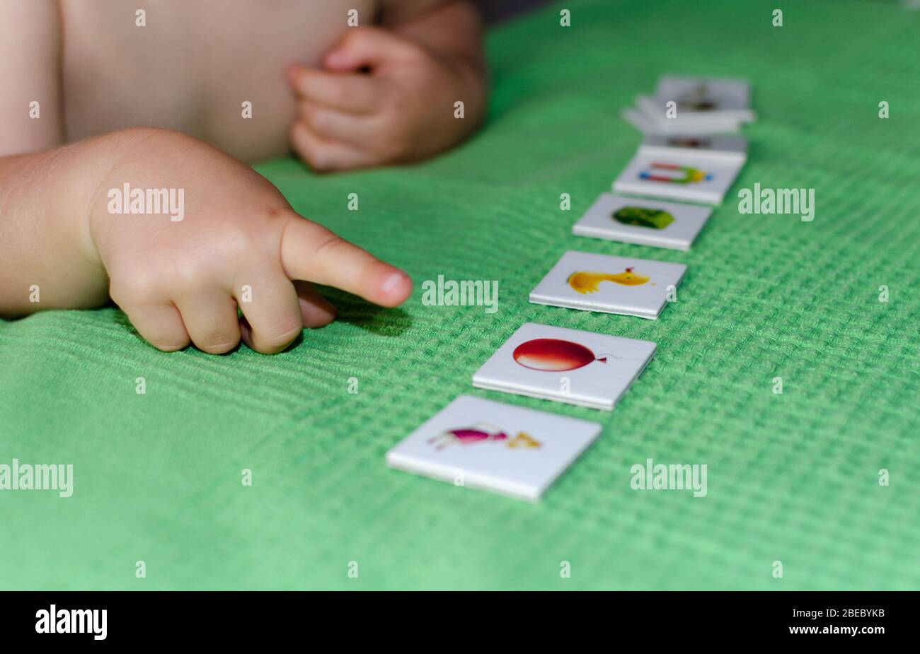child lining up toys