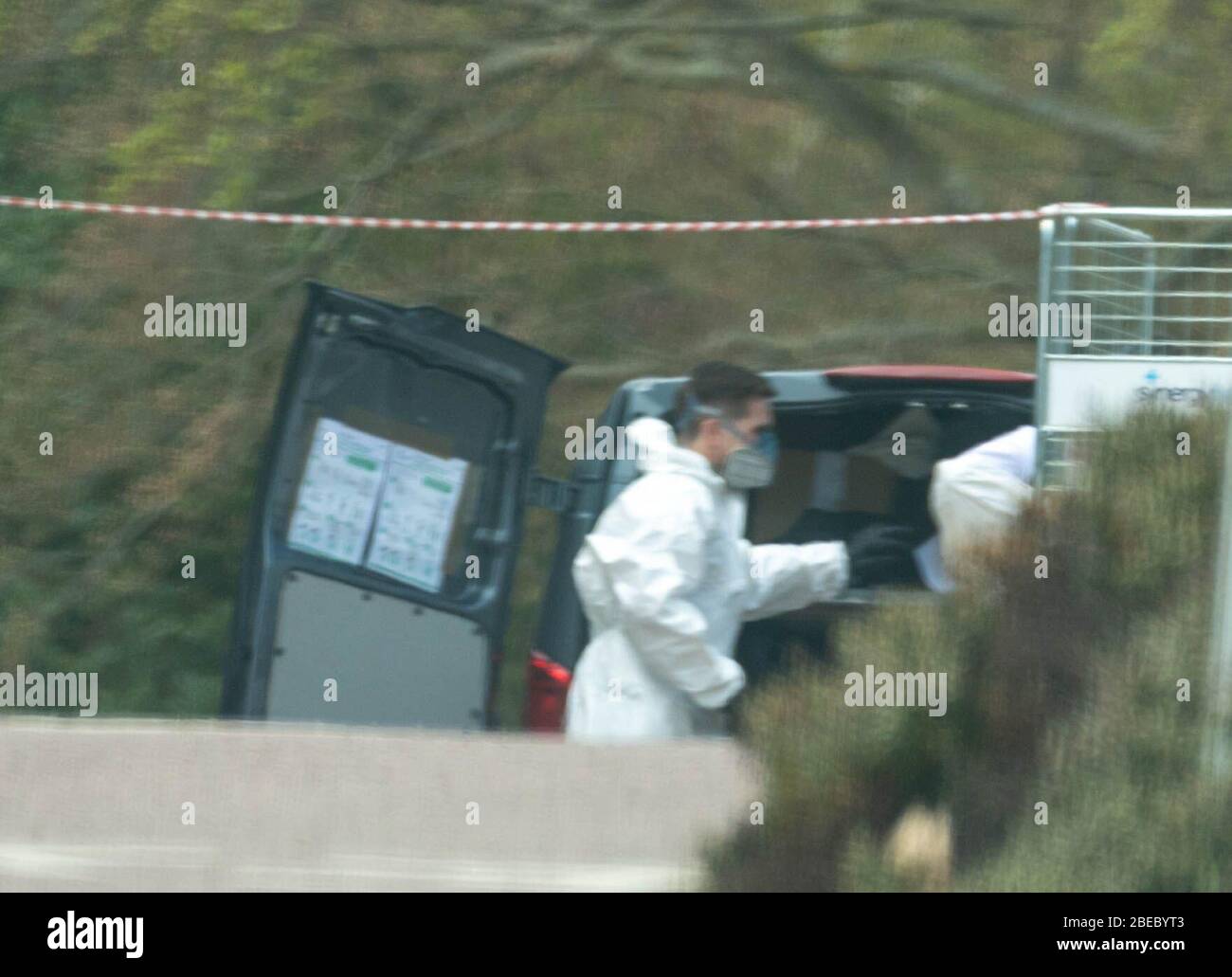 Brentwood Essex, UK. 13th Apr, 2020. Two undertakers remove their covid-19 Personal protective equipment at Brentwood Community hospital. Credit: Ian Davidson/Alamy Live News Stock Photo