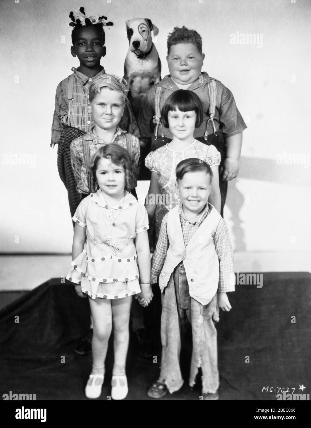 OUR GANG 1930 Group Portrait with (from top) ALLEN '' FARINA '' HOSKINS PETE the DOG NORMAN '' CHUBBY '' CHANEY  JACKIE COOPER MARY ANN JACKSON DOROTHY DeBORBA and BOBBY '' WHEEZER '' HUTCHINS director Robert McGowan Hal Roach Studios / Metro Goldwyn Mayer Stock Photo
