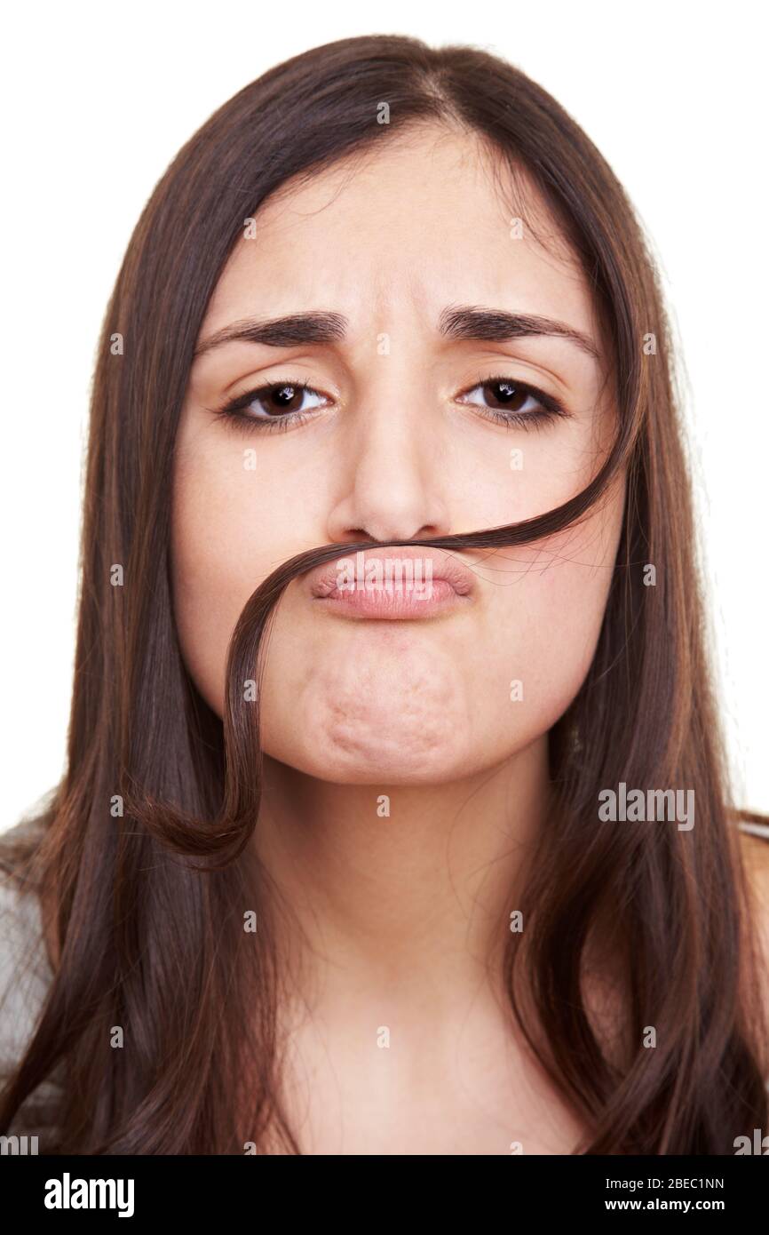 Young woman with a strand of hair as a false mustache Stock Photo
