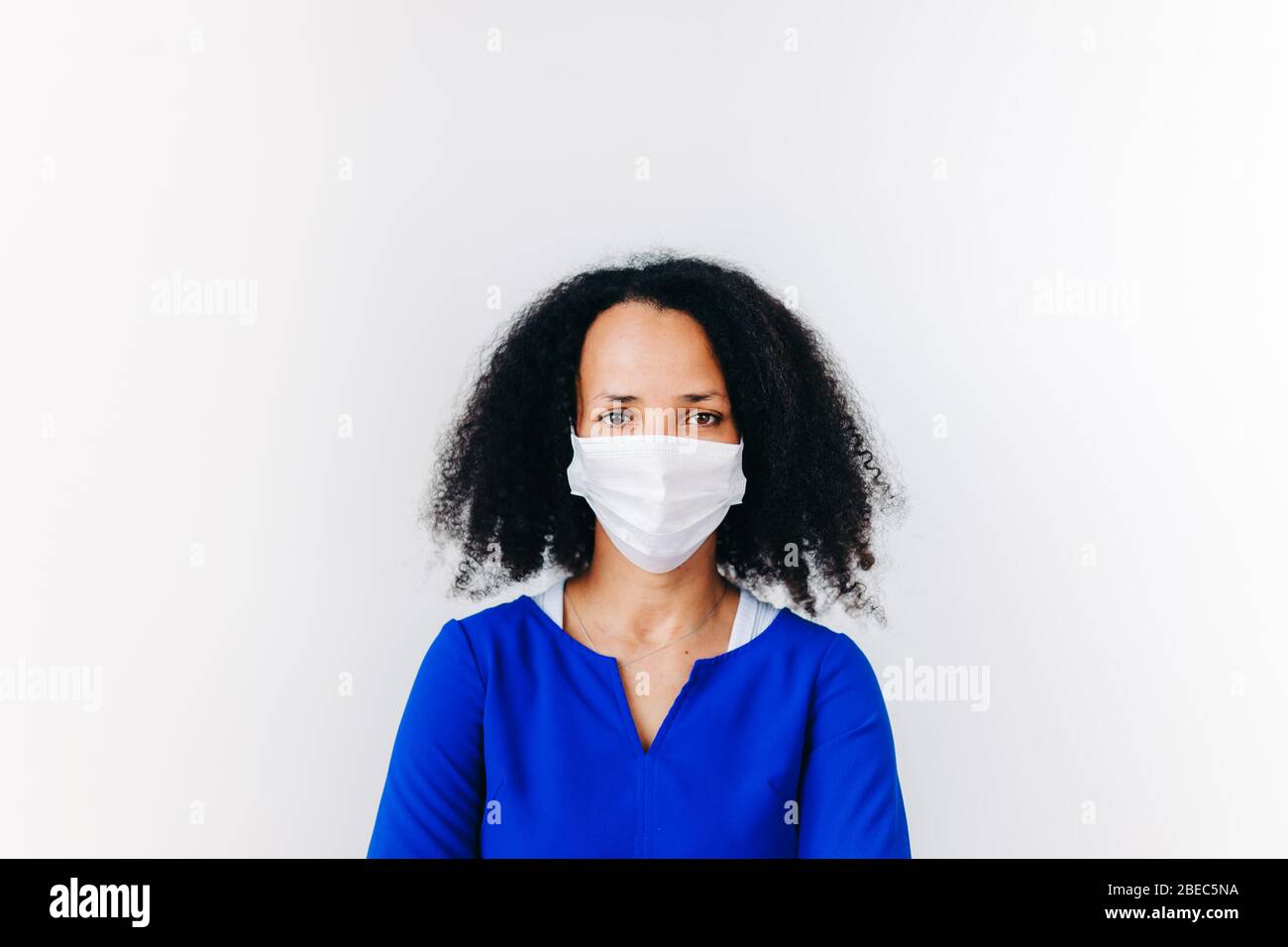 front view image of black woman with surgical mask against white ...