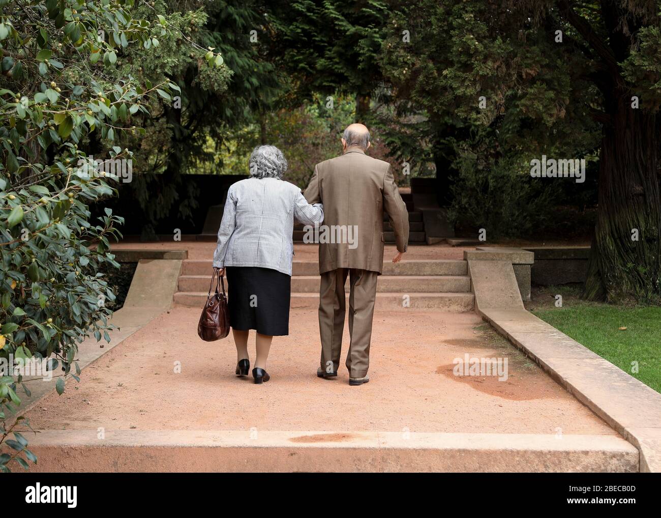 A Well Dressed Old Couple Walk Romantically Arm In Arm In The Park Stock Photo Alamy A Well Dressed Old Couple Walk Romantically Arm In Arm In The Park Stock Photo Alamy
