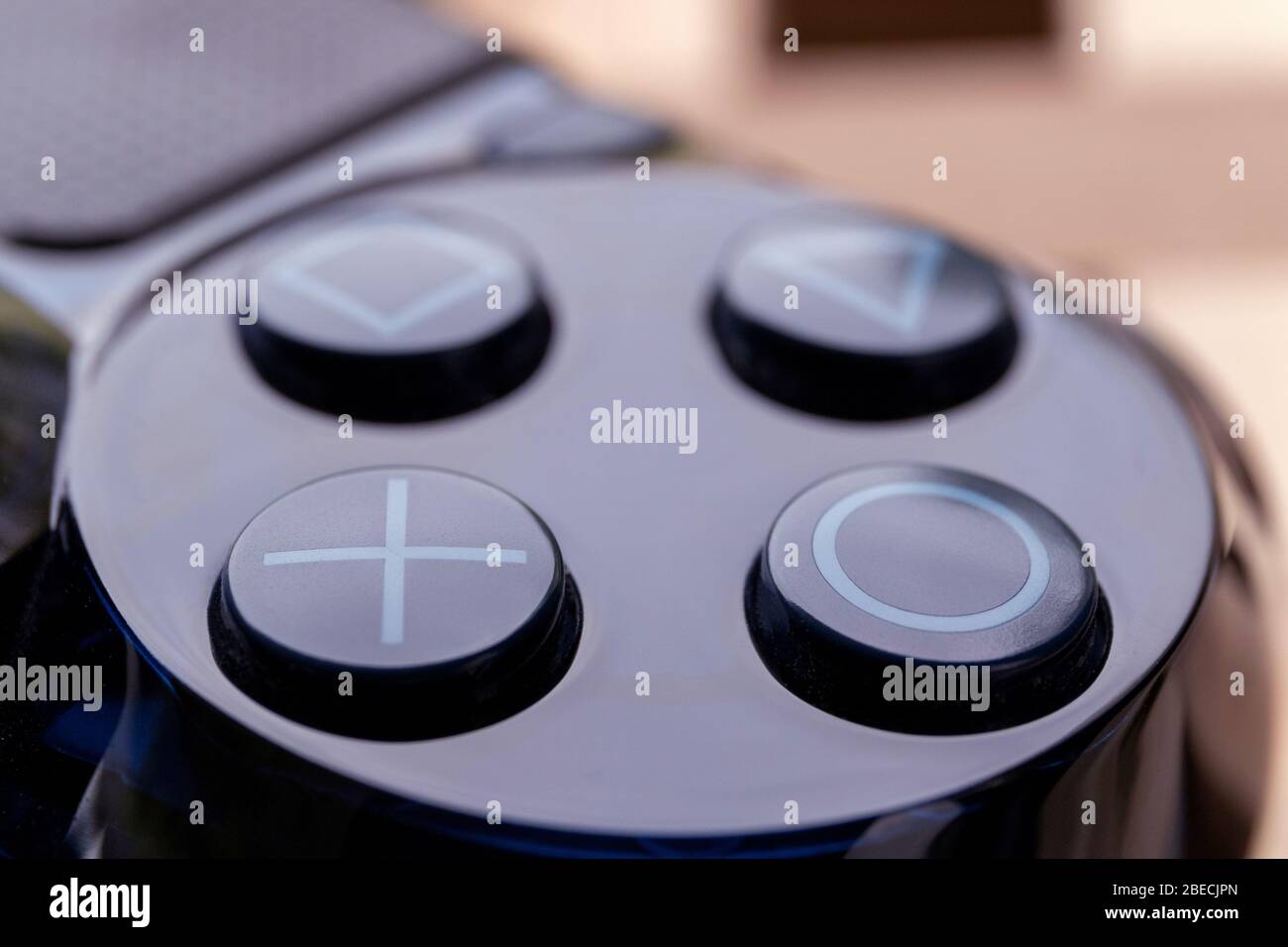 Brecht, Belgium - April 13 2020: A close up portrait of the iconic sony  Playstation buttons on a PS4 wireless controller. The square, cross,  triangle Stock Photo - Alamy