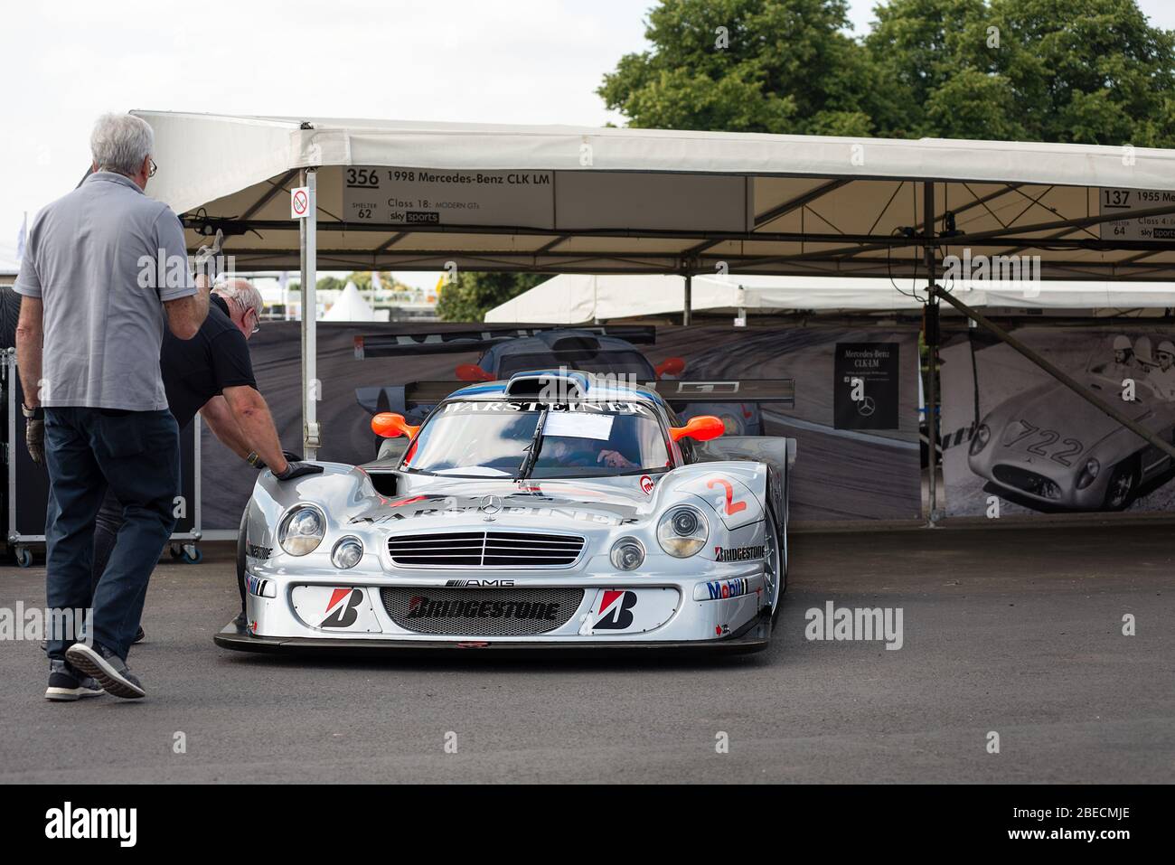 The No.2 Mercedes-AMG CLK GTR  race car being manually wheeled in to place at the Goodwood Festival of Speed car show. Stock Photo