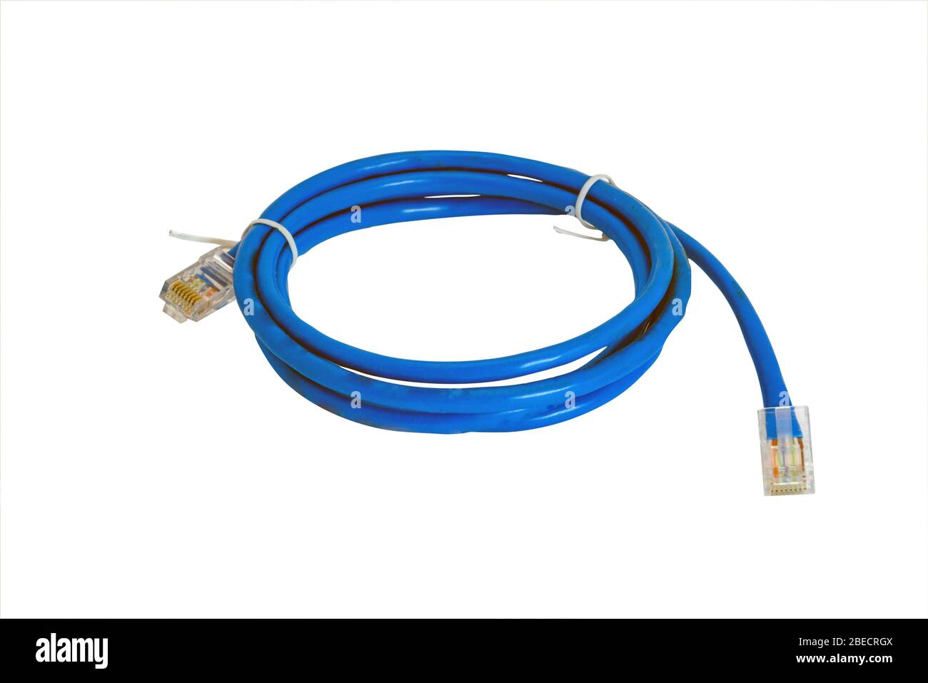 Twisted pair patch cord blue network Internet cable isolated over white background. Top view. Stock Photo