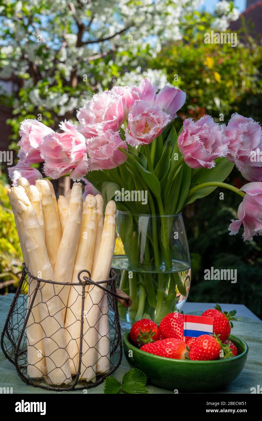 Dutch Farmers High Quality Products Fresh White Asparagus Red Ripe Strawberry And Pink Tulips Flowers In Spring Sunny Garden Stock Photo Alamy