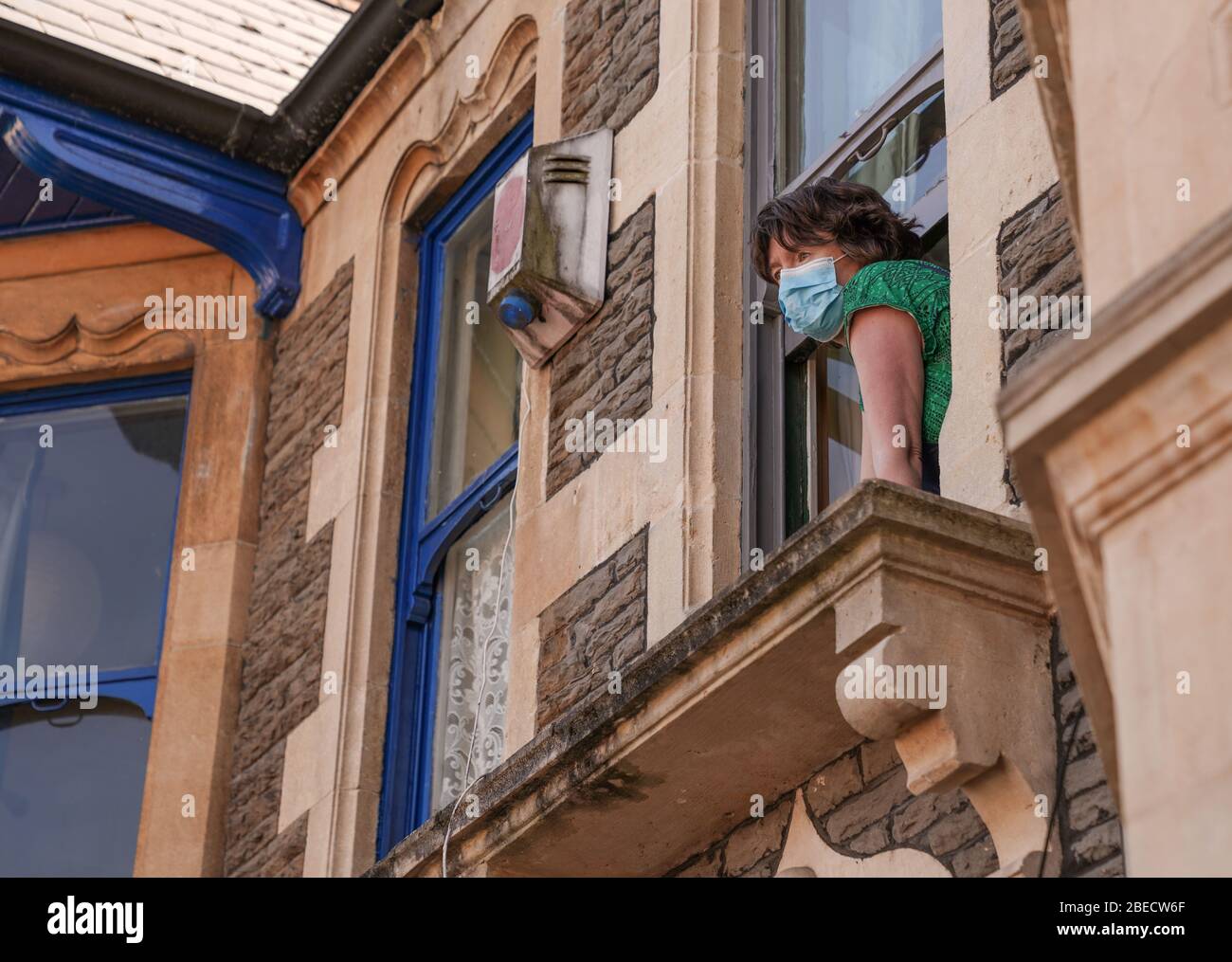 Cardiff, Wales, UK. 13th April 2020. Cardiff residents practice social distancing whilst checking on neighbours. UK public generally followed Governmewnt guidelines and stayed at home during a hot and sunny Easter Monday Bank Holiday. Credit: Haydn Denman/Alamy Live News. Stock Photo