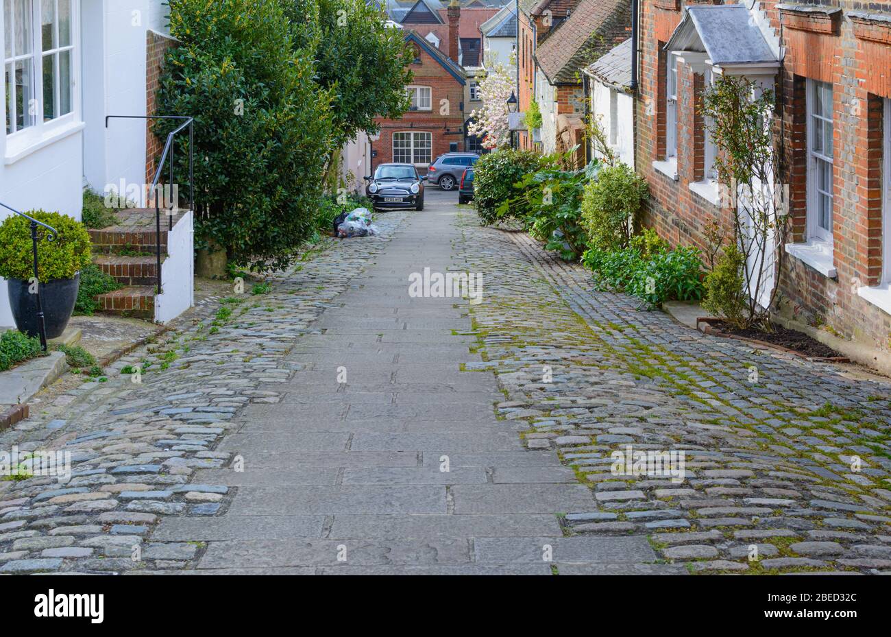 Bakers Arms Hill, a historic cobbled street on a steep hill in the historic market town on Arundel, West Sussex, England, UK. Stock Photo