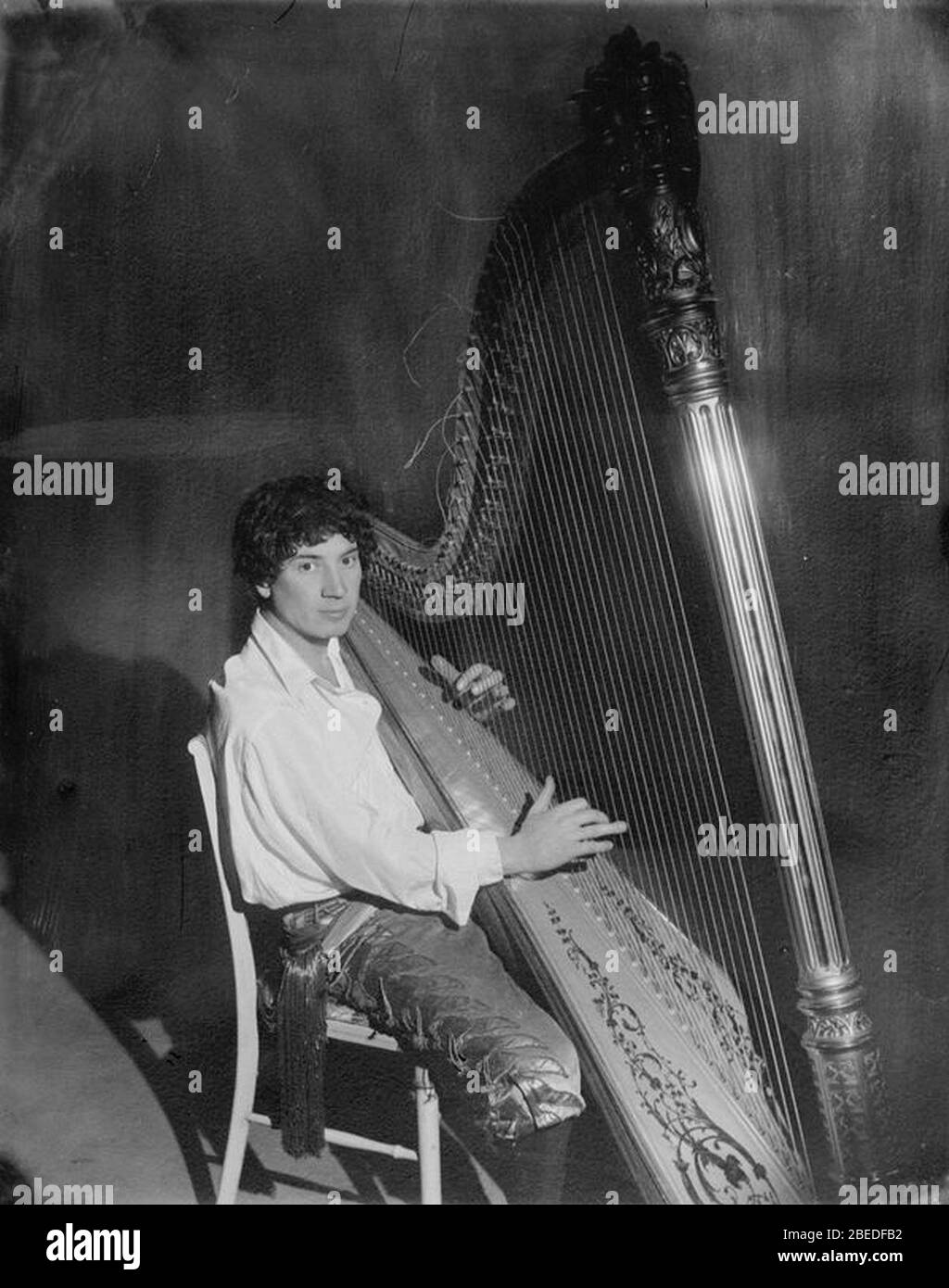 Harpo Marx playing the harp Stock Photo Alamy