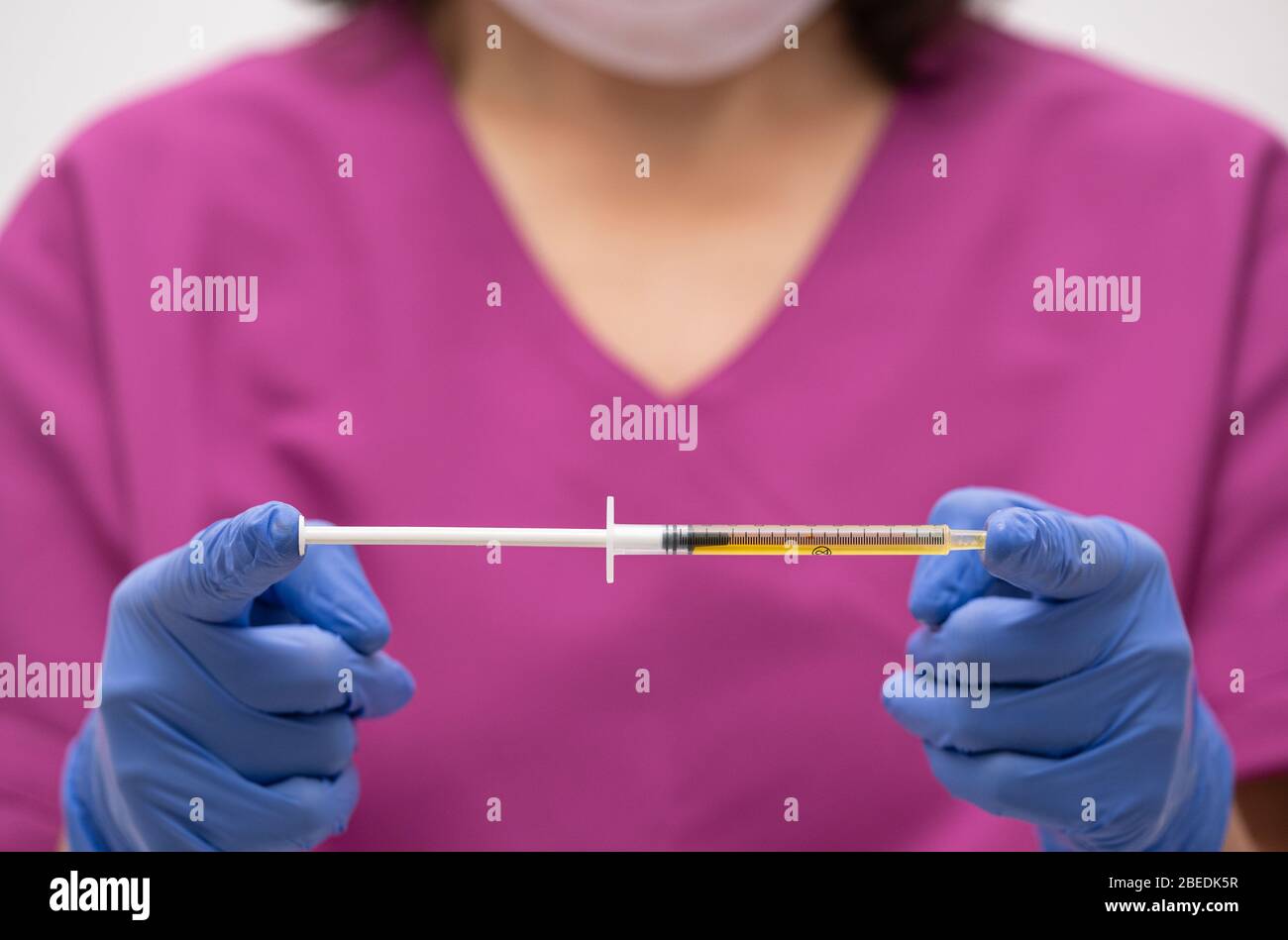 Syringe, medical injection in hand, palm or fingers. Plastic