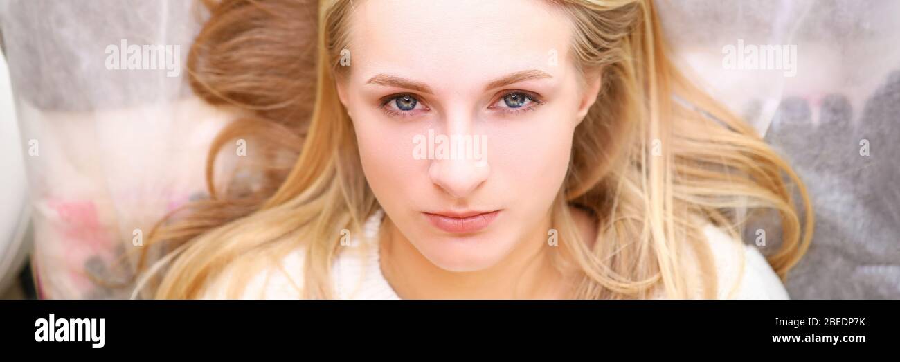 Good-looking lady in white sweater Stock Photo