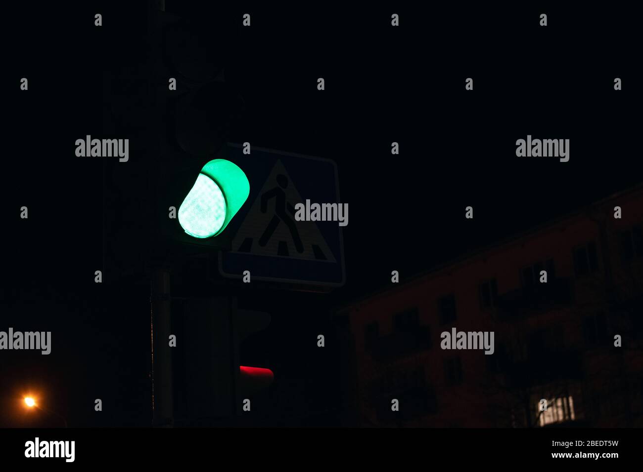 Red light at the intersection at night Stock Photo - Alamy