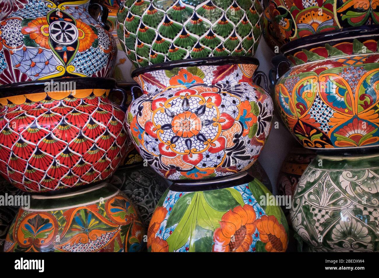 A stack of colorful Talavera pots sits in a Mexican market ready for sale in Puerto Peñasco, Sonora, Mexico. Stock Photo