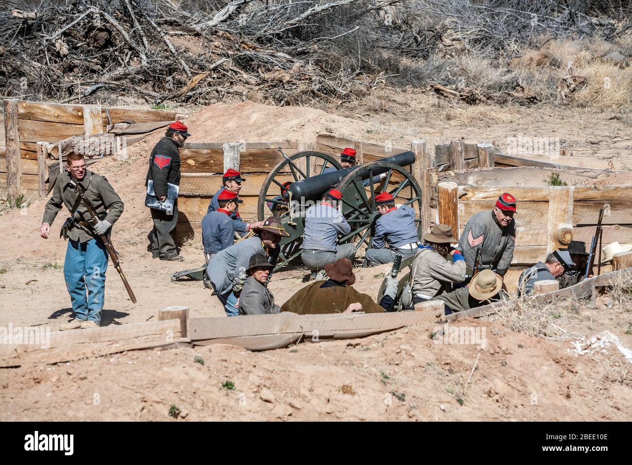 Confederate Army soldiers and cannon behind fortified mounds, Civil War reenactment, near Socorro, New Mexico USA Stock Photo