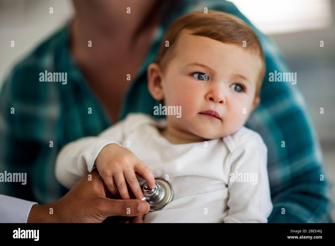 Baby listening to parent hires stock photography and images Alamy
