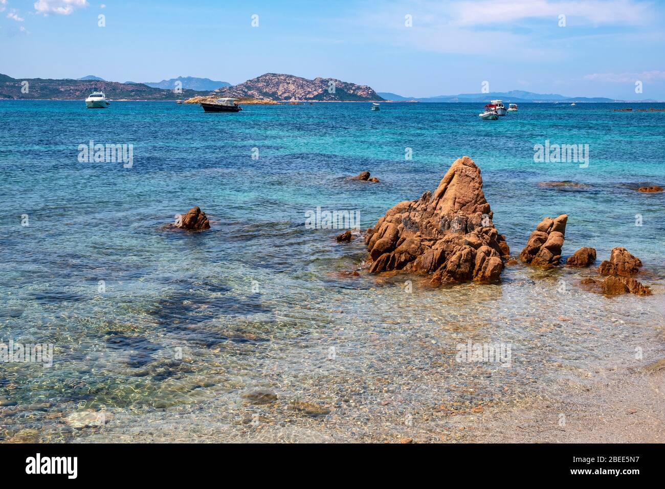 Tavolara, Sardinia / Italy - 2019/07/18: Picturesque Tyrrhenian Sea harbors with yachts offshore Isola Tavolara island off northern coast of Sardinia Stock Photo