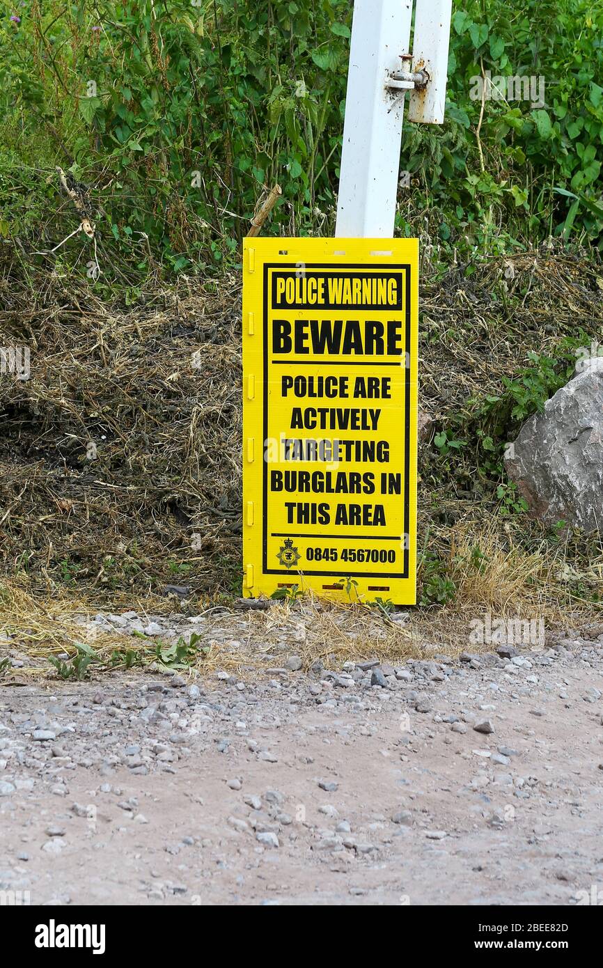 A sign saying police are actively targeting burglars in the area at Westhay Moor Nature Reserve, Somerset, England, UK Stock Photo