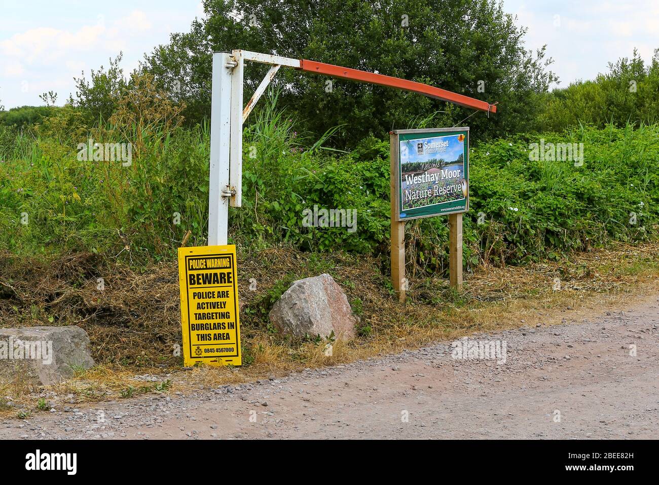 A sign saying police are actively targeting burglars in the area at Westhay Moor Nature Reserve, Somerset, England, UK Stock Photo