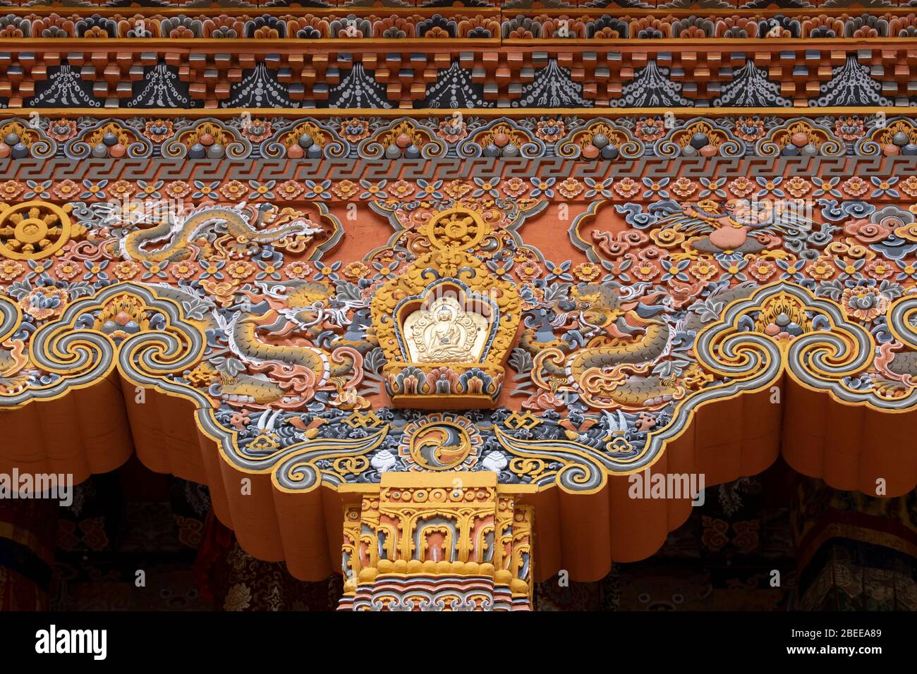 Bhutan, Punakha Dzong. Traditional hand painted and carved wooden architectural detail. Stock Photo