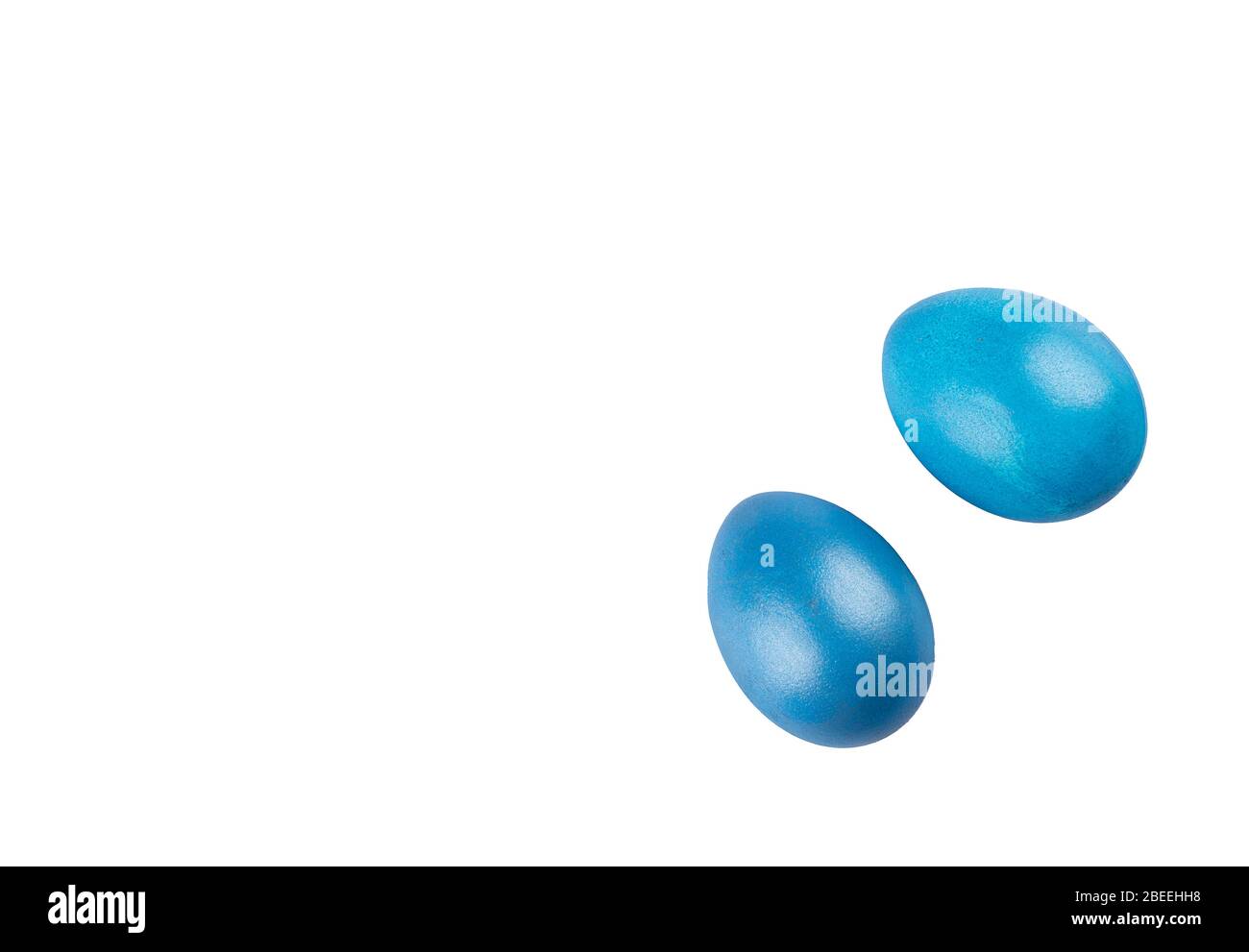 Two blue easter eggs isolated on white background. Flat lay. Copy space. Stock Photo