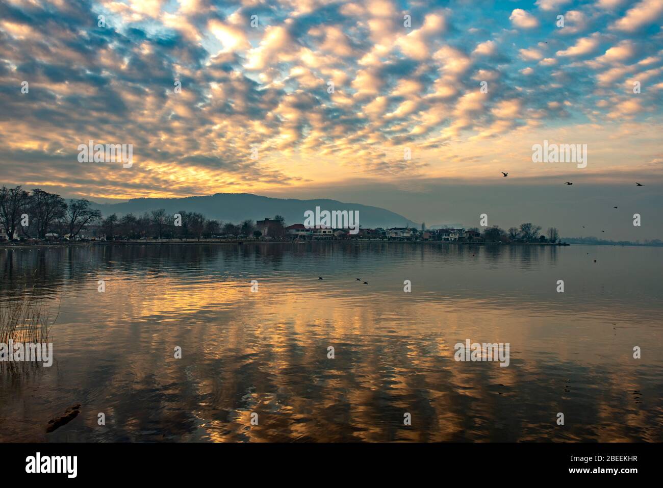 View to the lake Pamvotis. Ioannina city at sunset.Greece Stock Photo