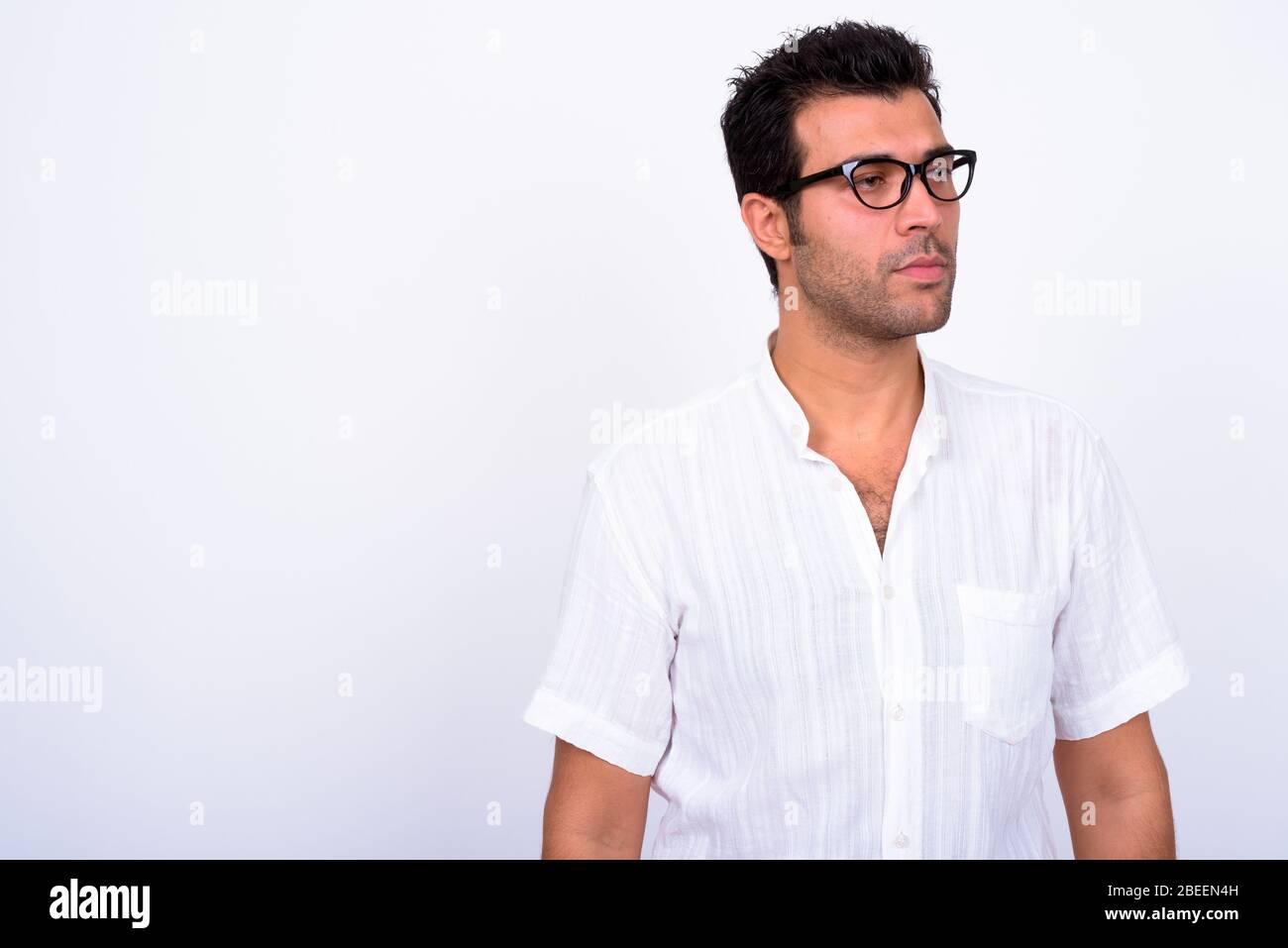 Portrait of handsome Turkish man with eyeglasses thinking Stock Photo