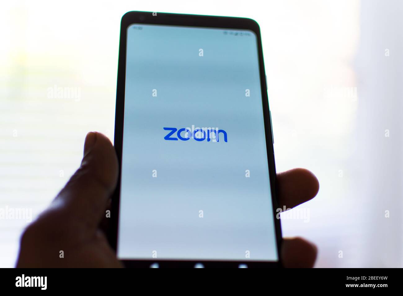 ZOOM video conference app on phone Stock Photo