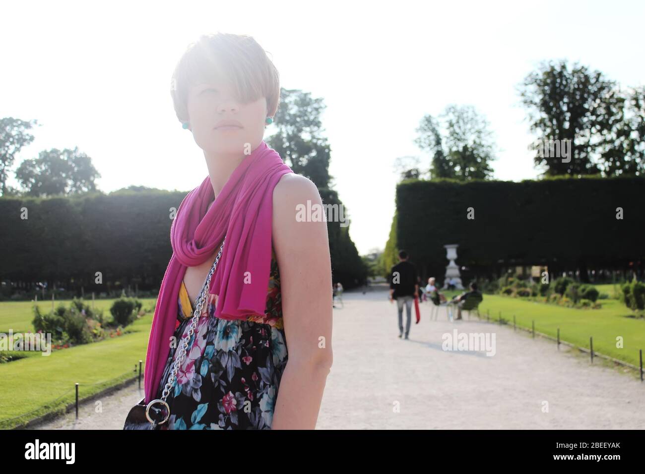 Beautiful young Parisian woman posing in Tuileries Garden Stock Photo