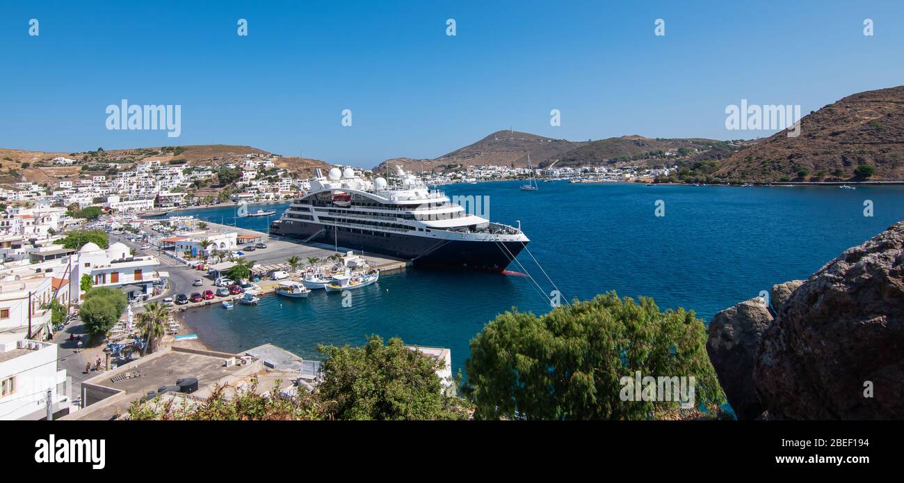 Skala village and cruise harbor in Patmos Island, Greece. Panoramic aerial landscape view. Stock Photo