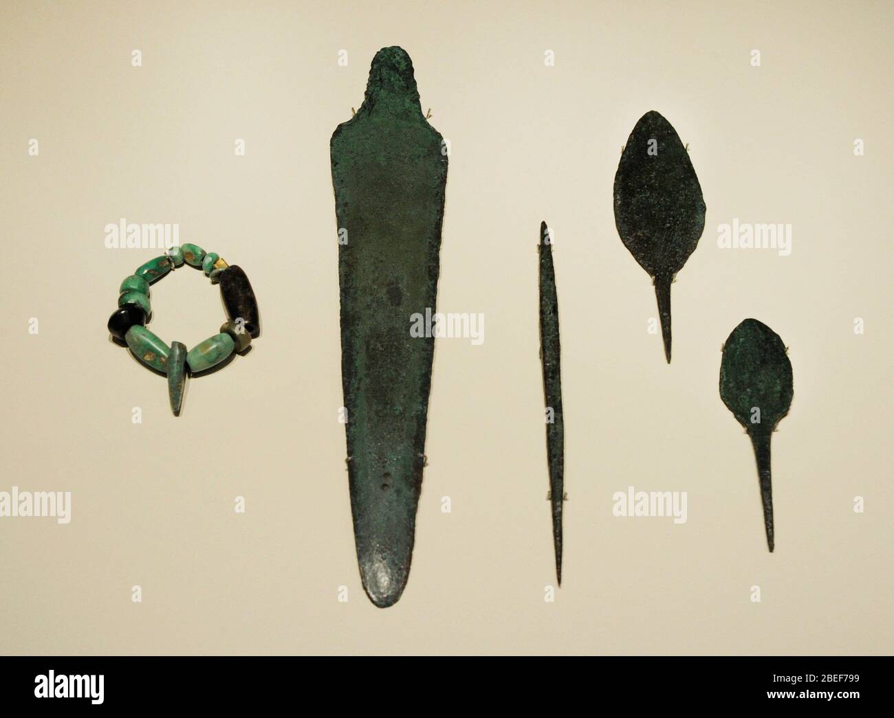 Beads of necklace, dagger, punch and javelin tips Stock Photo Alamy