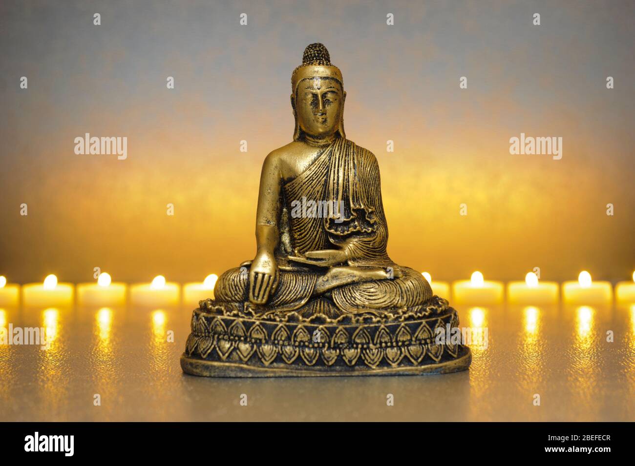 Japanese ZEN garden with candle lights and Buddha sculpture Stock Photo