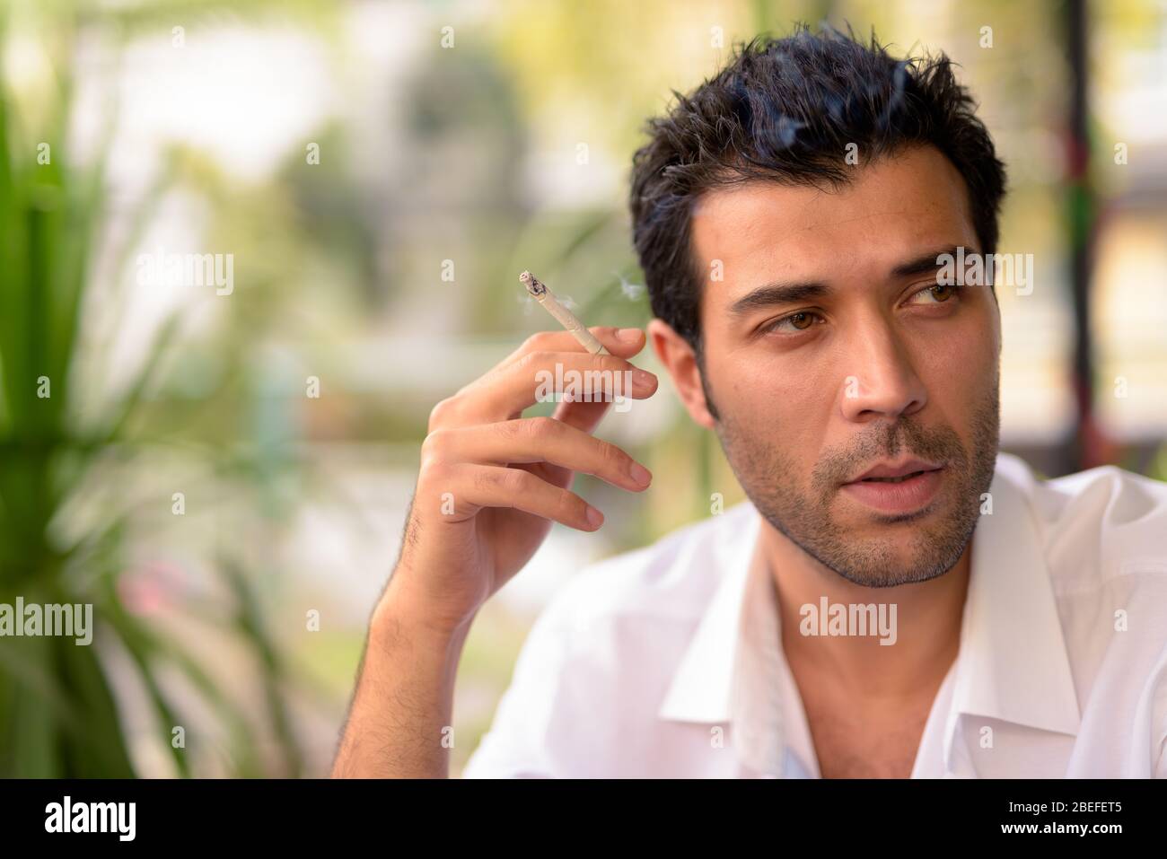 Face of handsome Turkish man at the coffee shop Stock Photo