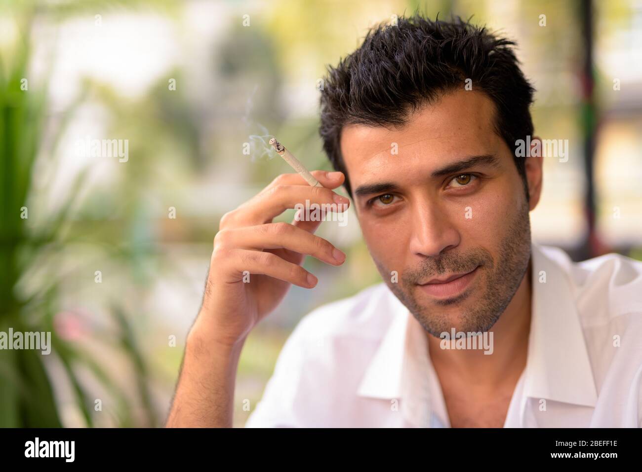 Face of handsome Turkish man at the coffee shop Stock Photo