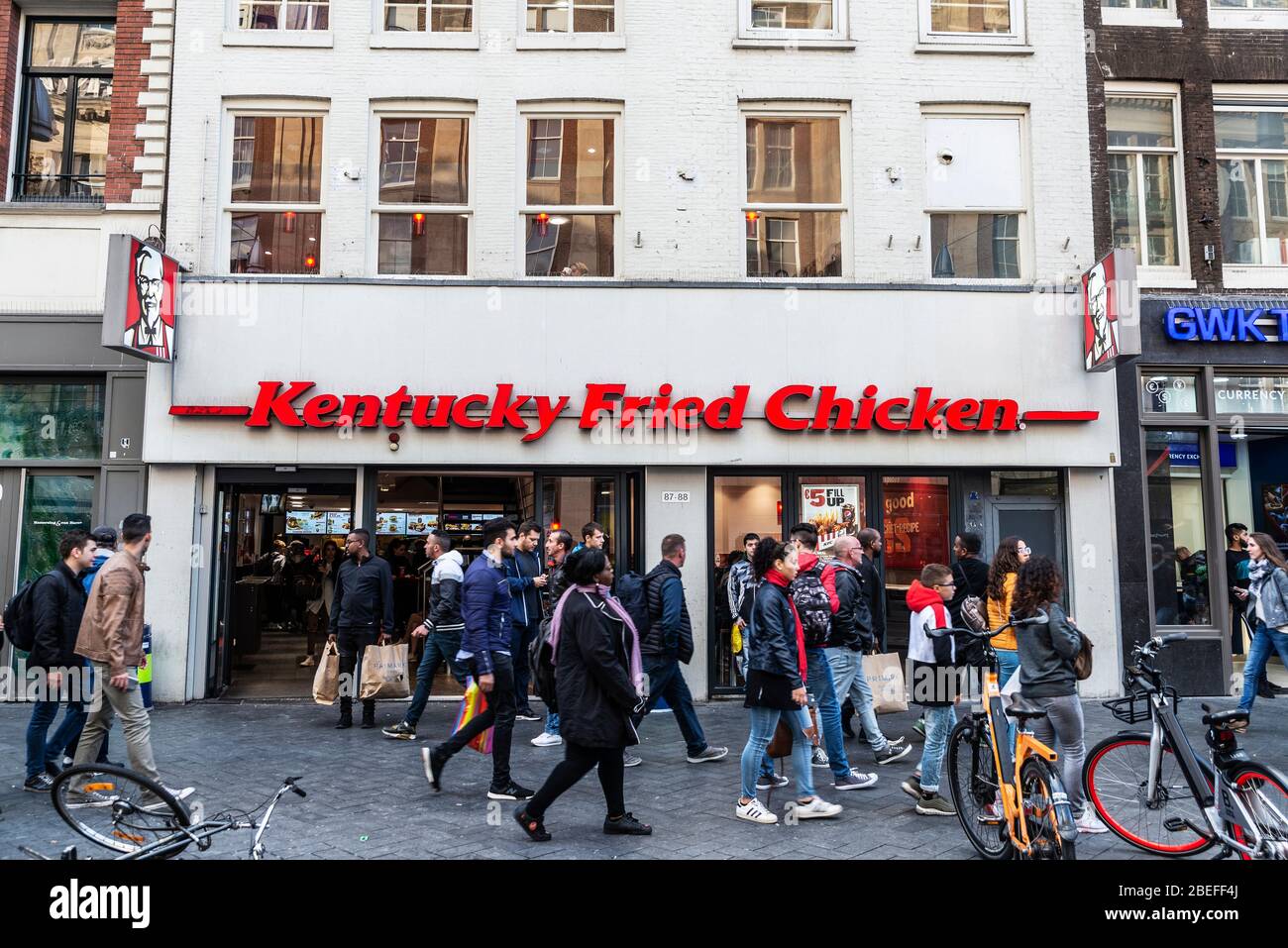 Amsterdam, Netherlands - September 7, 2018: Facade of a Kentucky Fried Chicken (KFC) Restaurant with people around in the centre of Amsterdam, Netherl Stock Photo