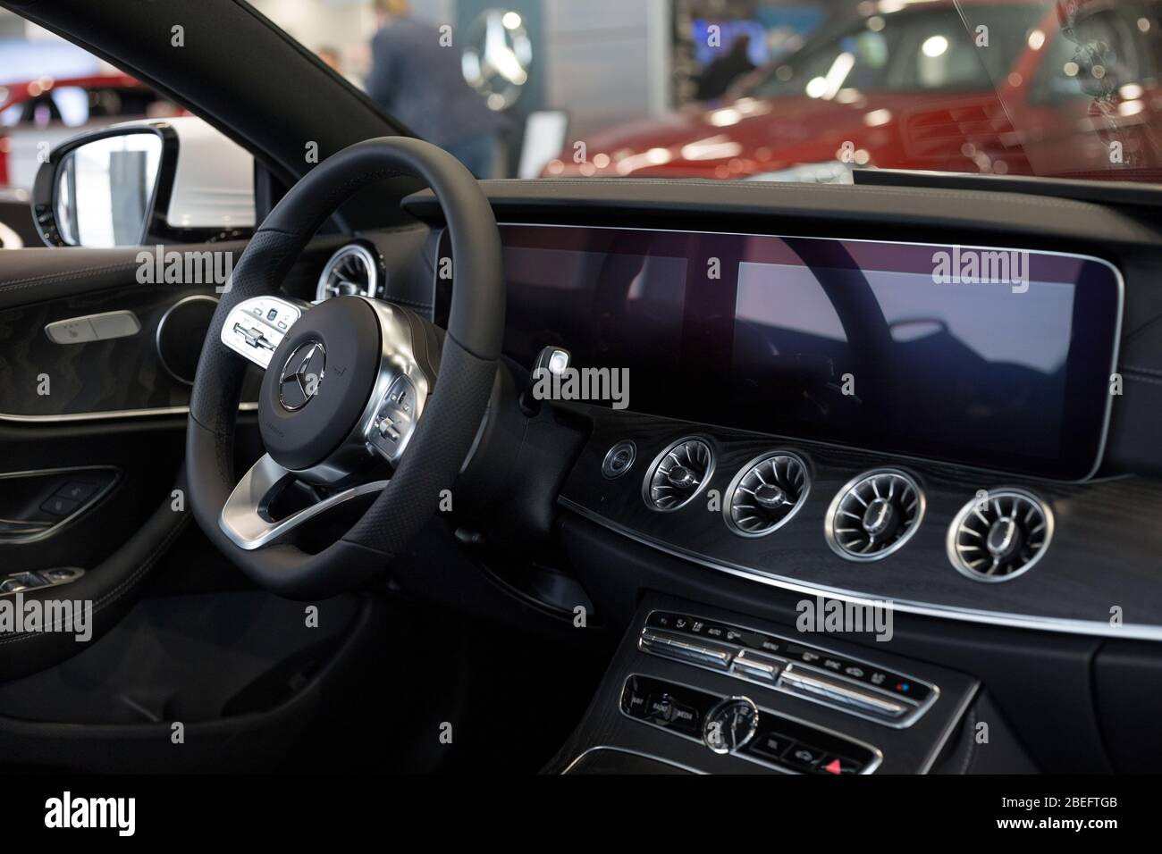 Russia, Izhevsk - February 20, 2020: Mercedes-Benz showroom. Interior of new modern E 200 coupe car. Famous world brand. Prestigious vehicles. Stock Photo