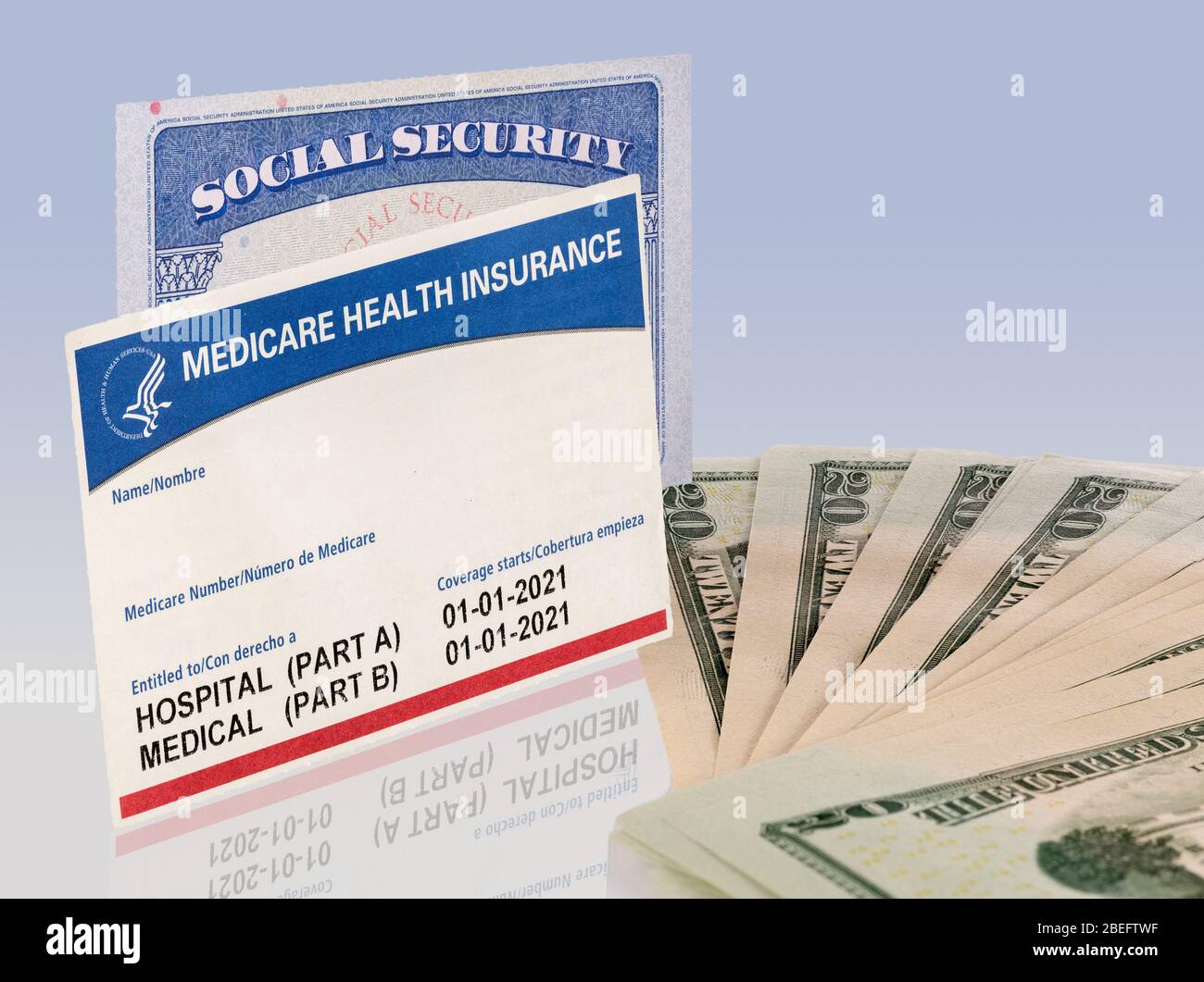 USA social security card and a Medicare health insurance card with 20 dollar paper currency to show funding crisis Stock Photo