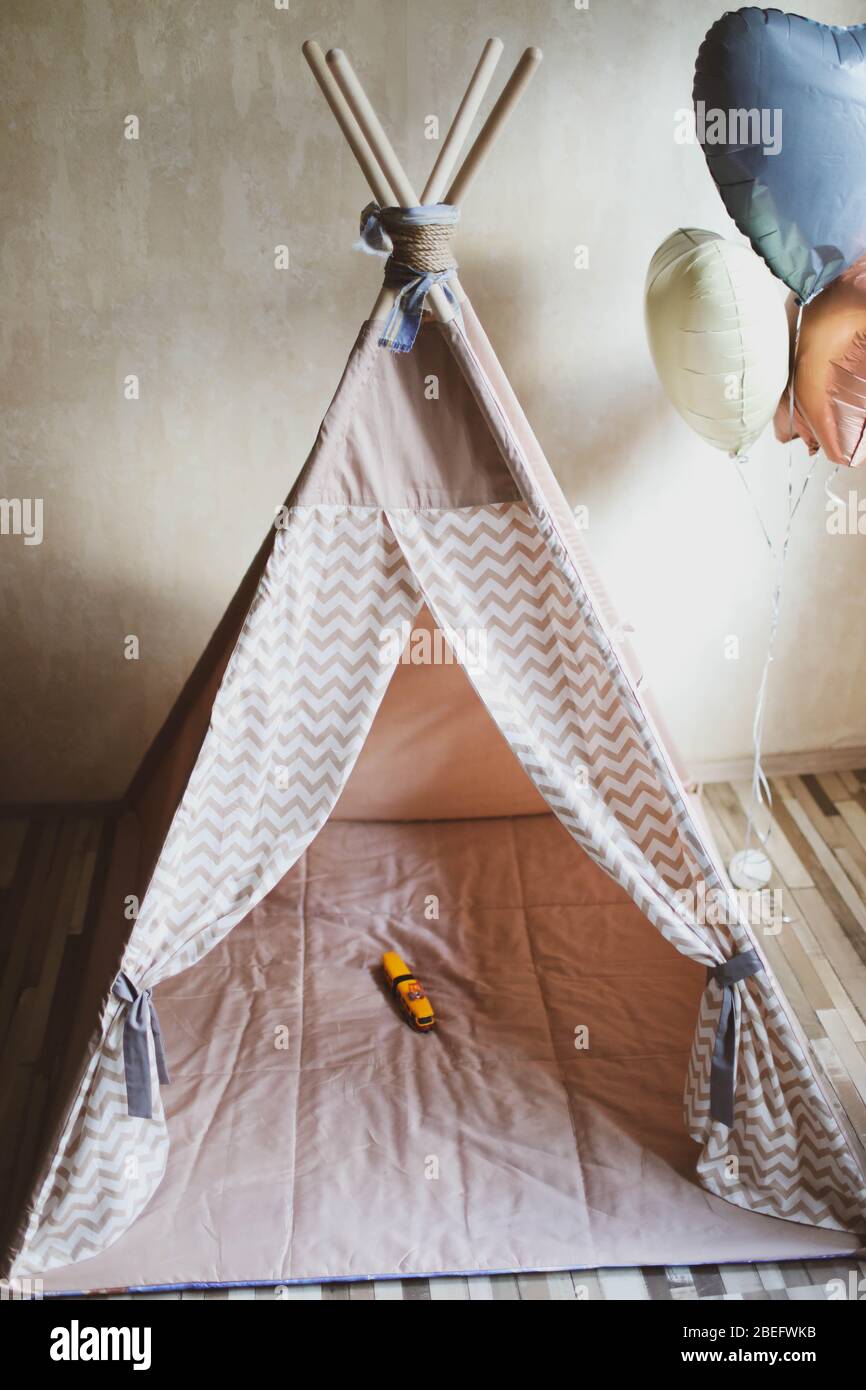 Children's wigwam for a beige boy. In the nursery Stock Photo Alamy