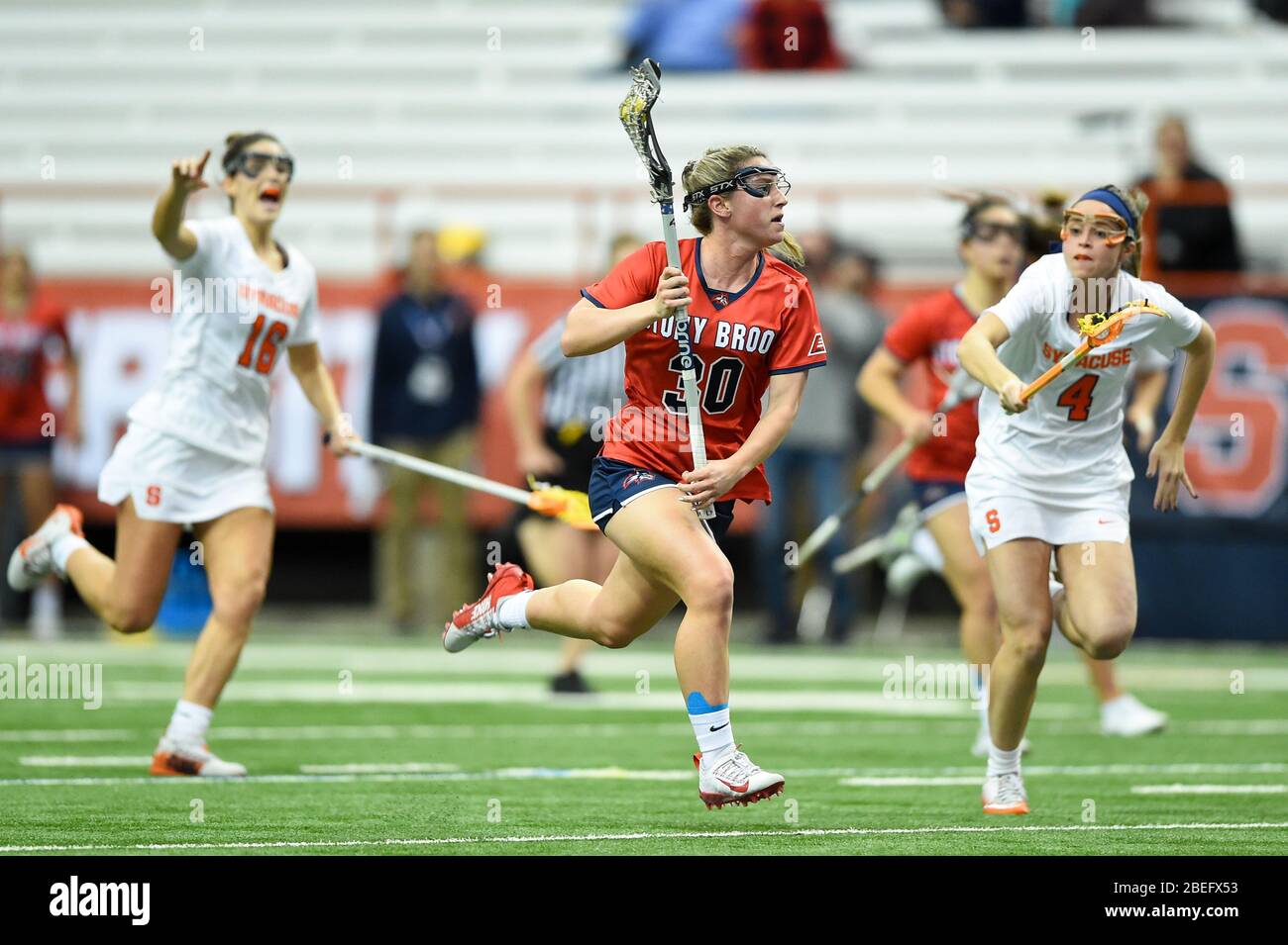 Syracuse, New York, USA. 10th Feb, 2020. Stony Brook Seawolves midfielder Ally Kennedy #30 runs with the ball in front of Syracuse Orange midfielder Cara Quimby #4 during an NCAA womens lacrosse game on Monday, Feb, 10, 2020 at the Carrier Dome in Syracuse, New York. Stony Brook won 17-16. Rich Barnes/CSM/Alamy Live News Stock Photo