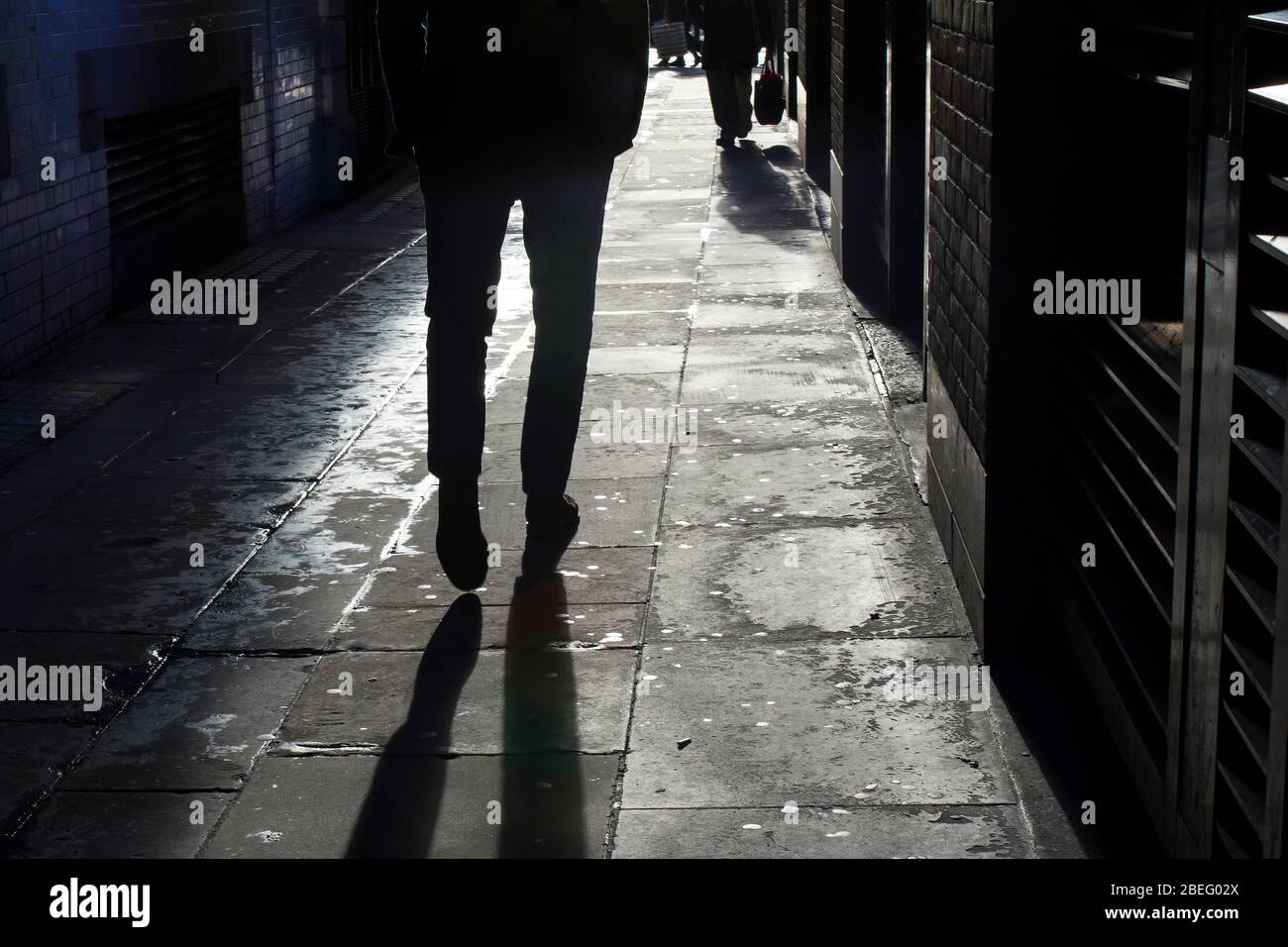 Silhouette man walking down street hi-res stock photography and images ...