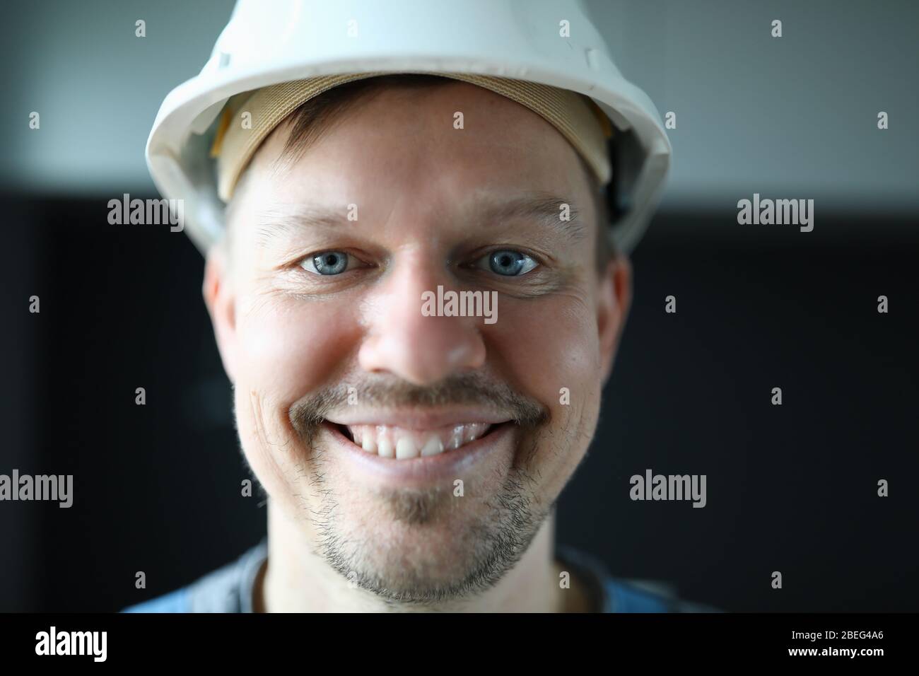 Smiling disposable man in uniform Stock Photo Alamy