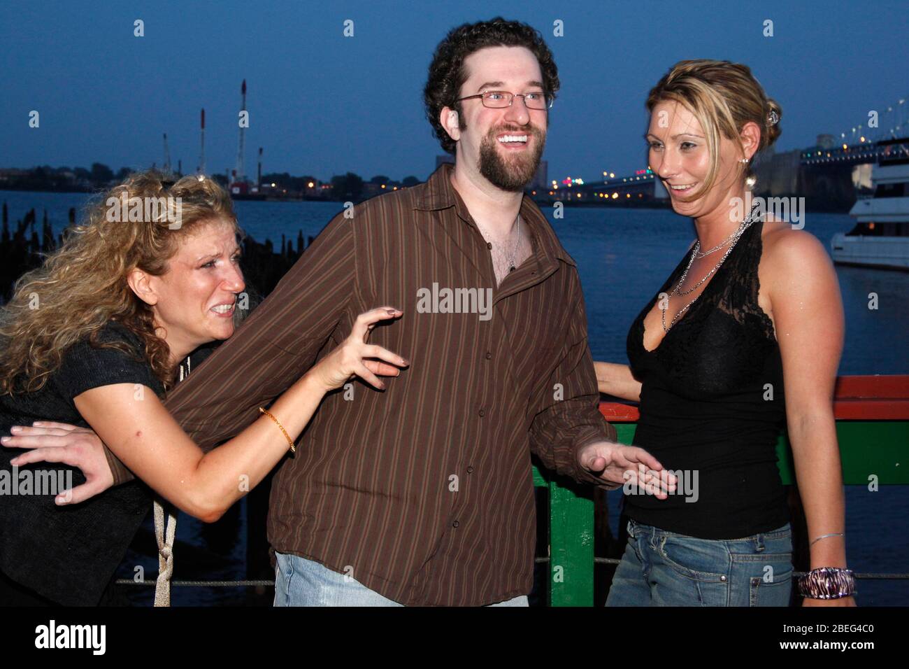 Devon James pictured with guest referee Dustin Diamond and Susan Finkelstein, her opponent, at Big Bang boxing press conference at Cavanaugh's in Philadelphia on July 28, 2010    Credit: Scott Weiner/MediaPunch Stock Photo