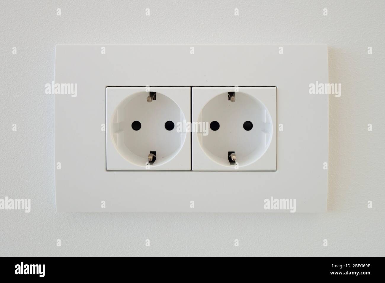 The socket twin double white EU standard with grounding. Stock Photo